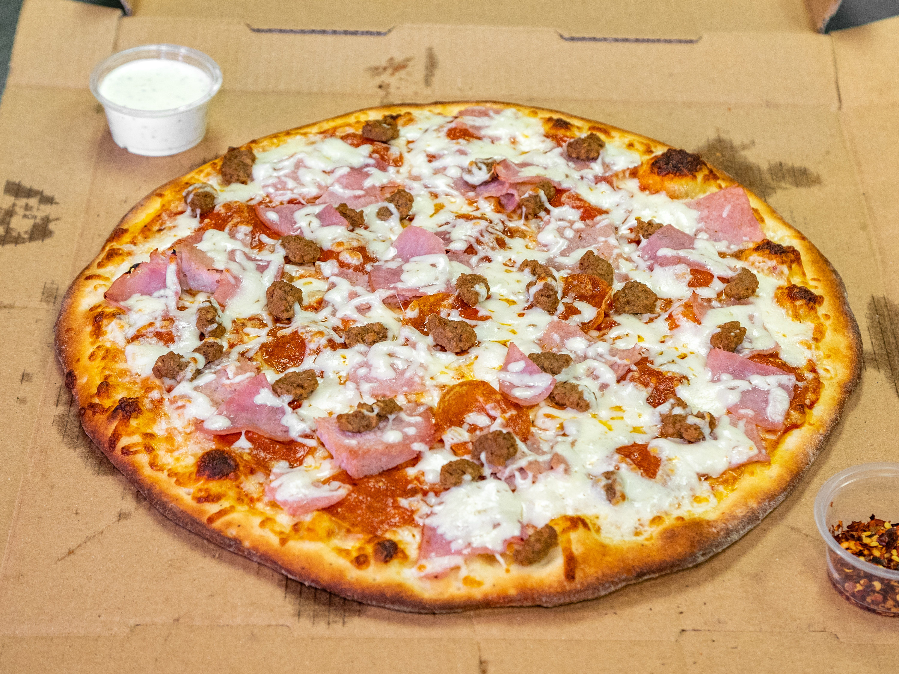 Order Meat Lovers Pizza food online from Venice Pizzeria store, Santa Clarita on bringmethat.com