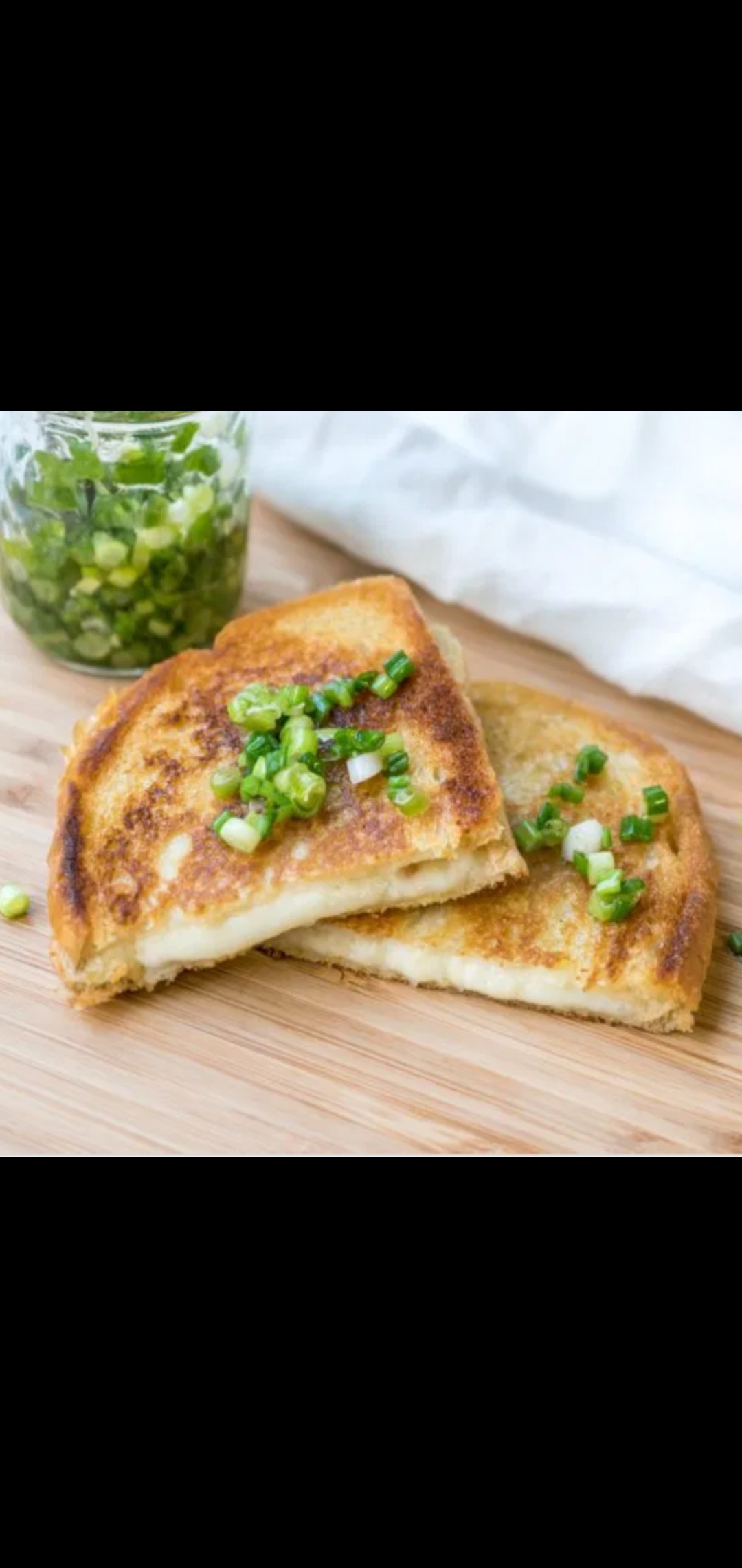 Order Grilled Cheese With Green Onions  food online from American Gourmet Foods Deli store, New York on bringmethat.com