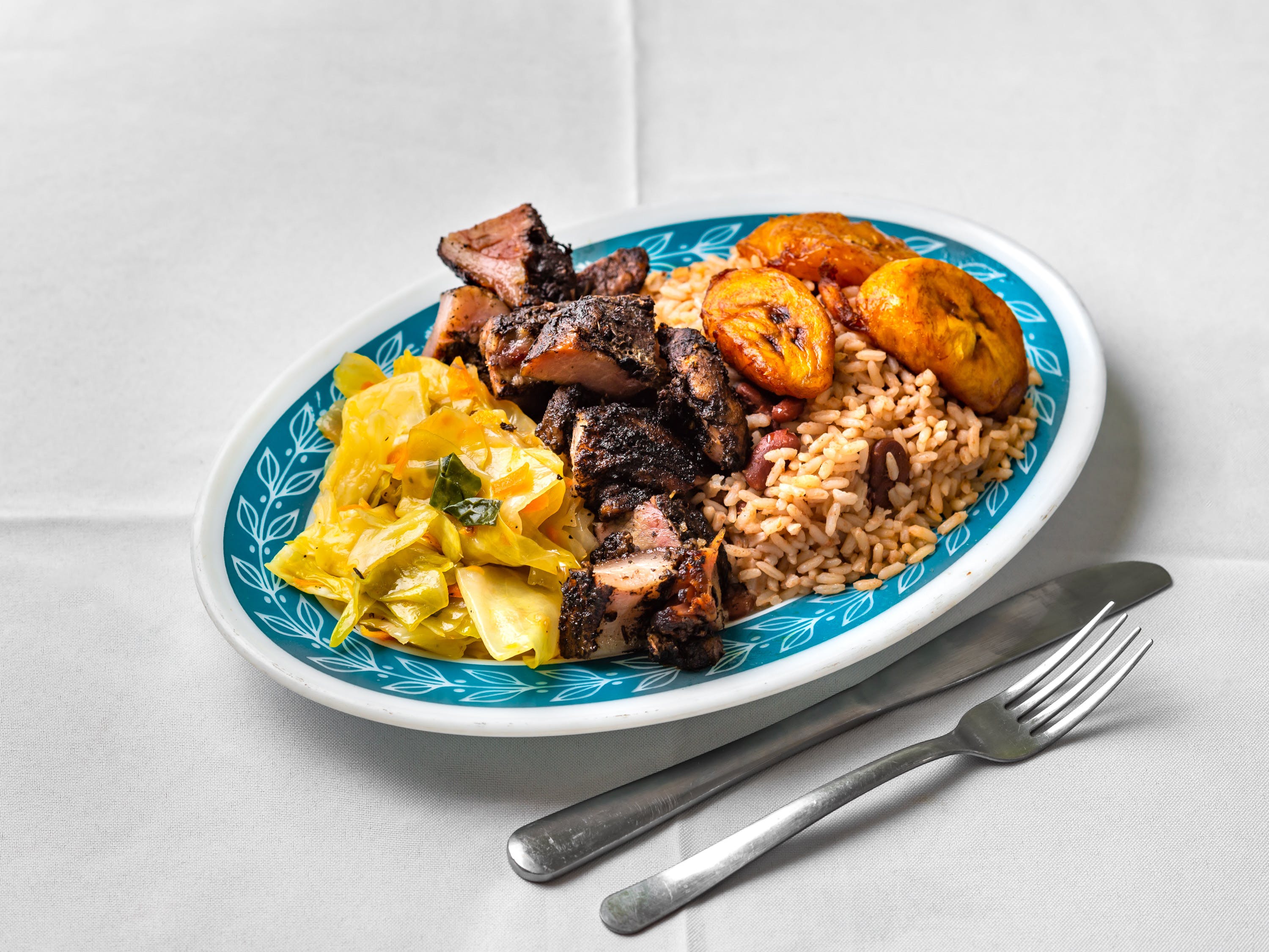 Order Jerk Pork Meal - Half food online from Rhythm And Spice Pizzeria And Grill store, New Brunswick on bringmethat.com