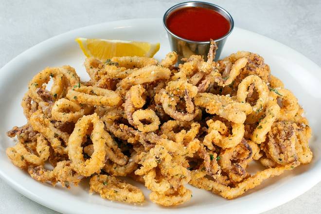 Order HAND-BREADED CALAMARI food online from Johnny Carino's store, Sioux Falls on bringmethat.com