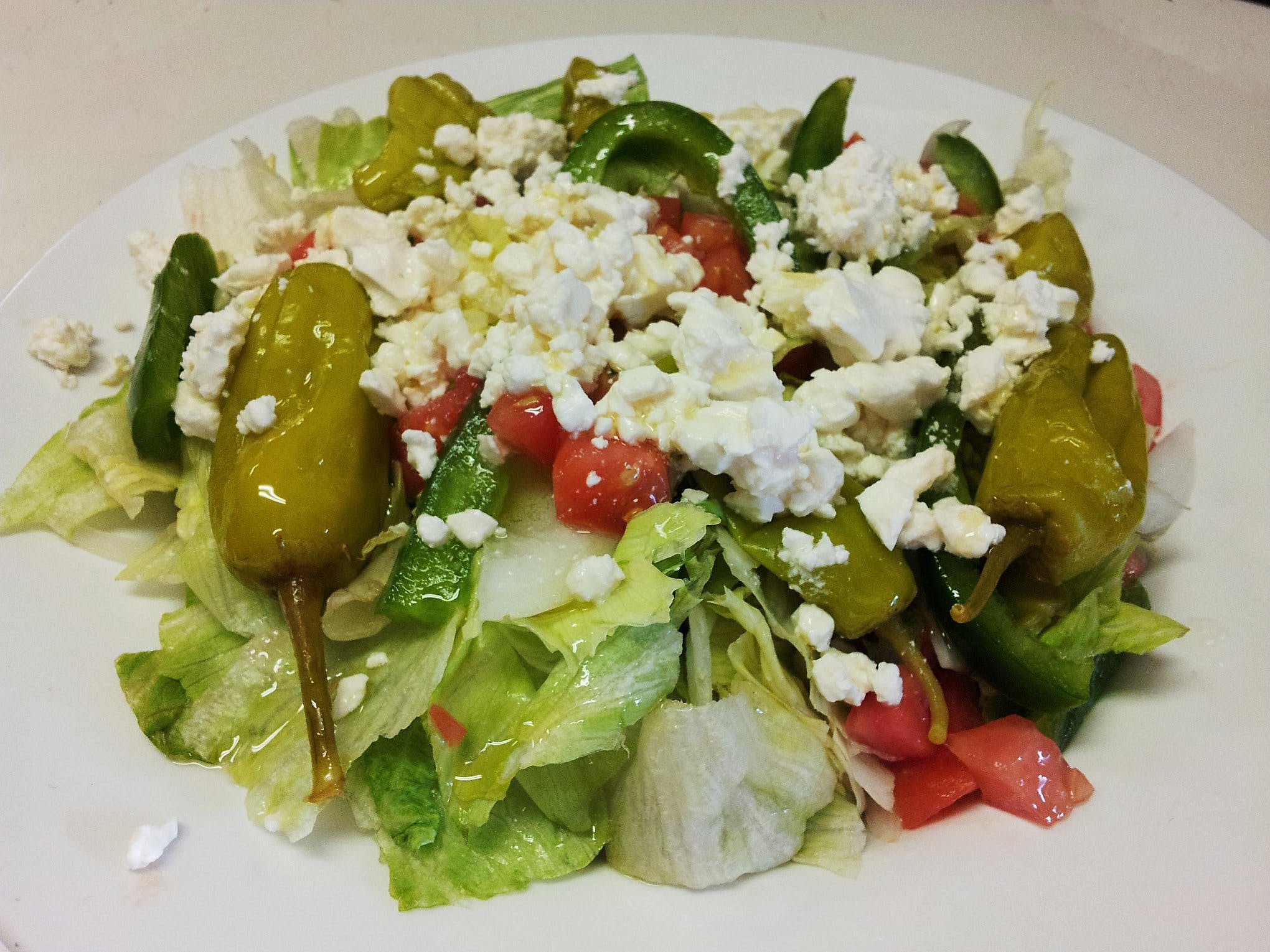 Order Greek Salad - Salad food online from Nicky's Pizza store, Sheboygan on bringmethat.com