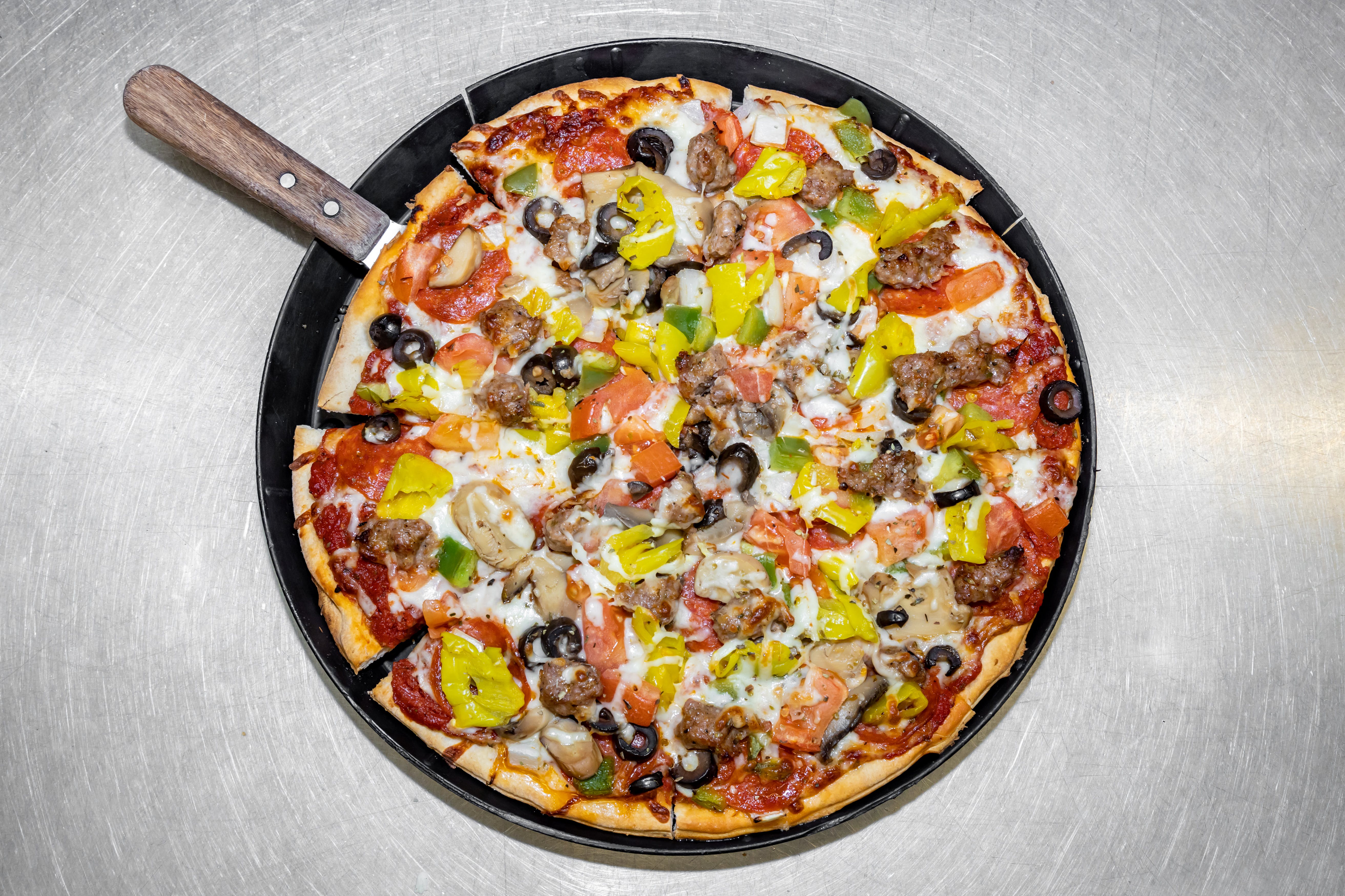 Order The Kitchen Sink Pizza - Medium 12" food online from Luconi's Pizza store, Bradley on bringmethat.com