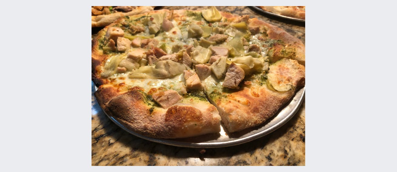 Order Chicken Pesto & Artichoke Pizza - Regular 10'' (Serves 1-2) food online from Craftsman Wood Fired Pizza store, Placentia on bringmethat.com
