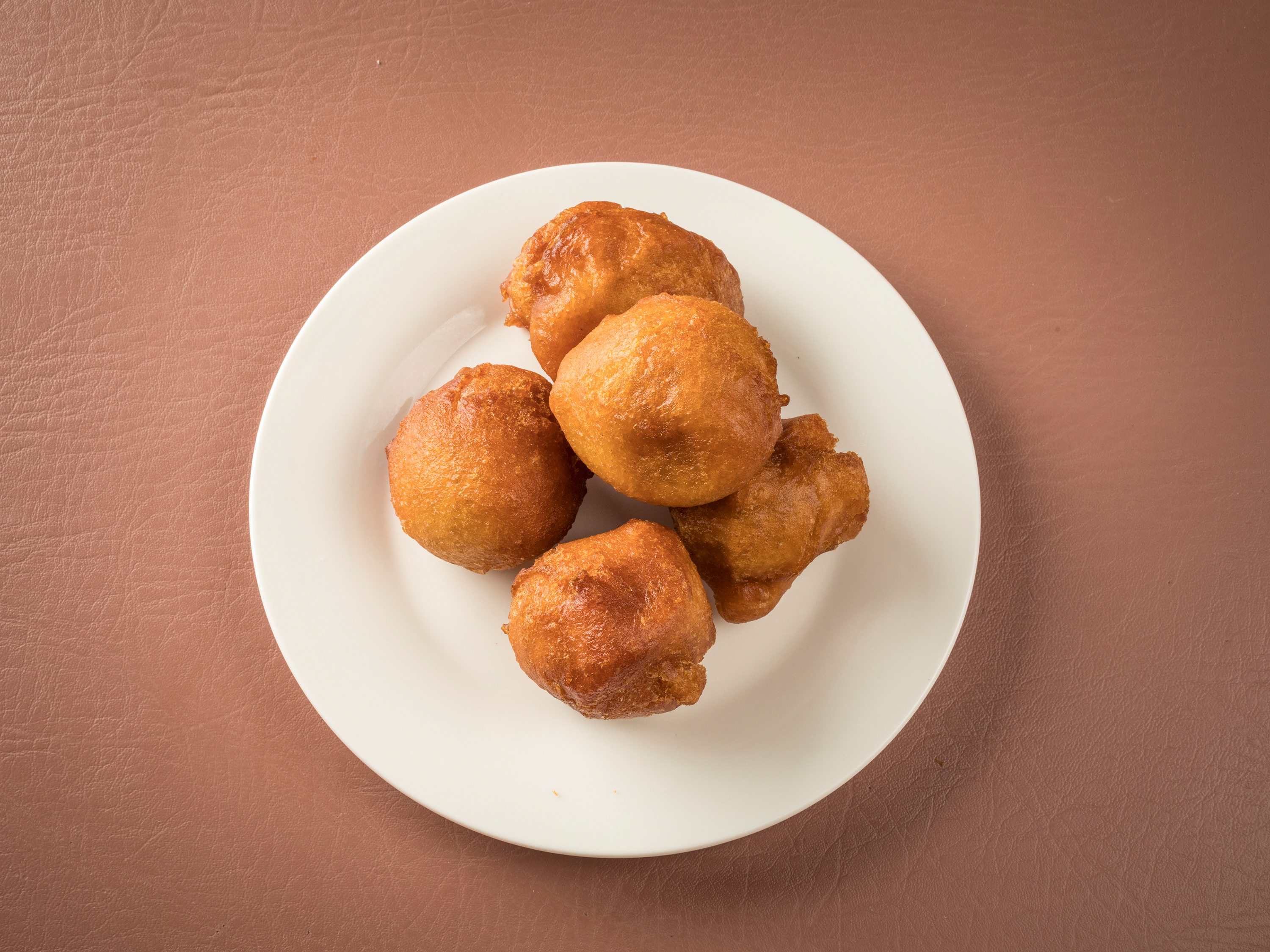 Order 4 Pieces Puff Puff food online from Village Restaurant store, Pawtucket on bringmethat.com
