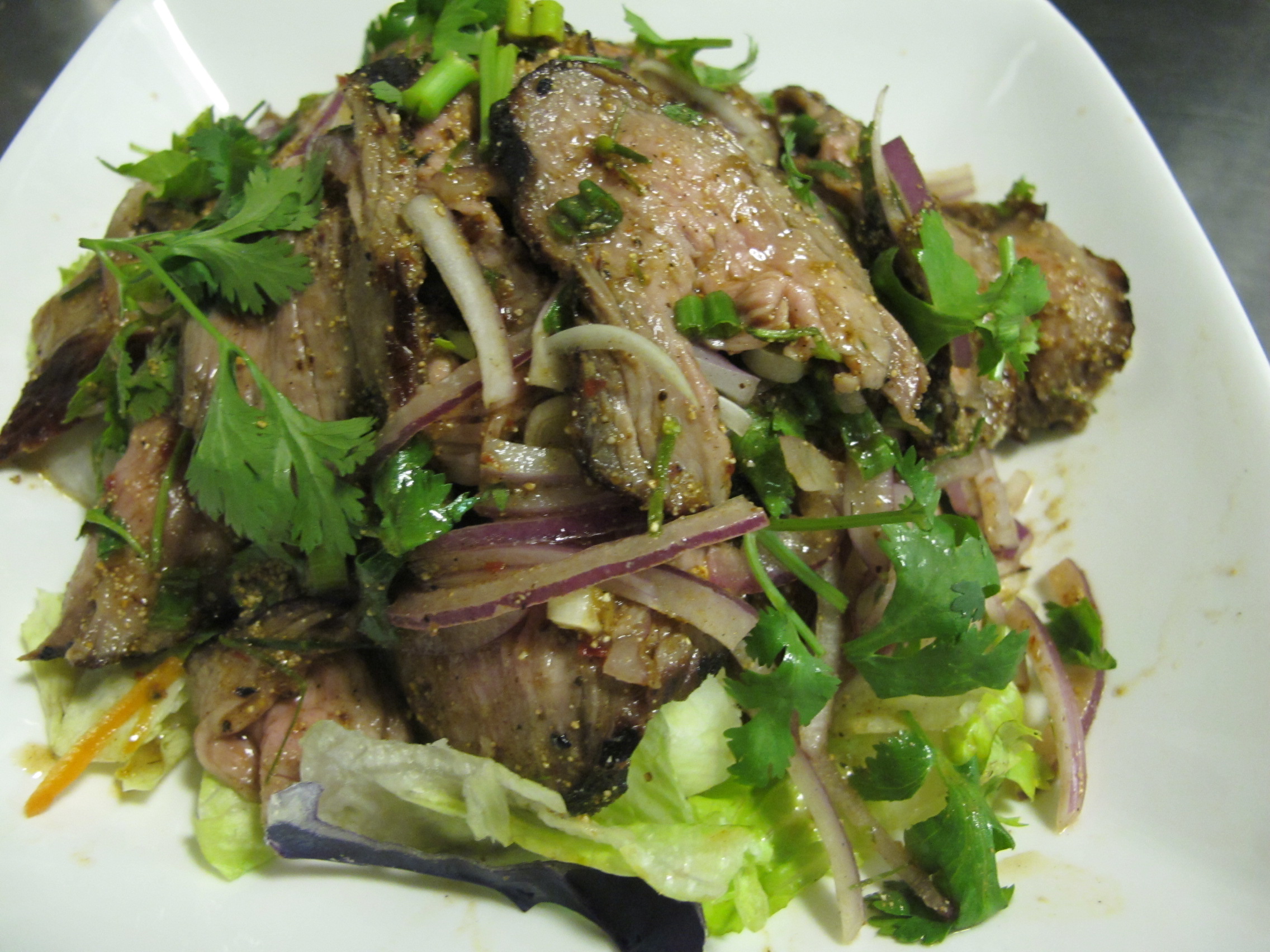Order 23. Neua num tok (beef salad) food online from Thailand Restaurant store, Modesto on bringmethat.com
