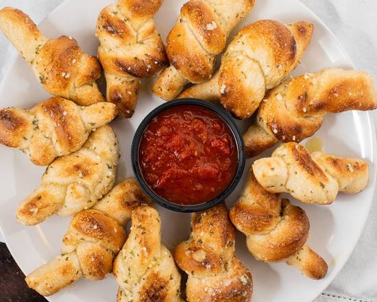 Order Garlic Knots with Sauce (12 Pc) food online from Vivaldi's Pizza (Terryville)  store, Bristol on bringmethat.com