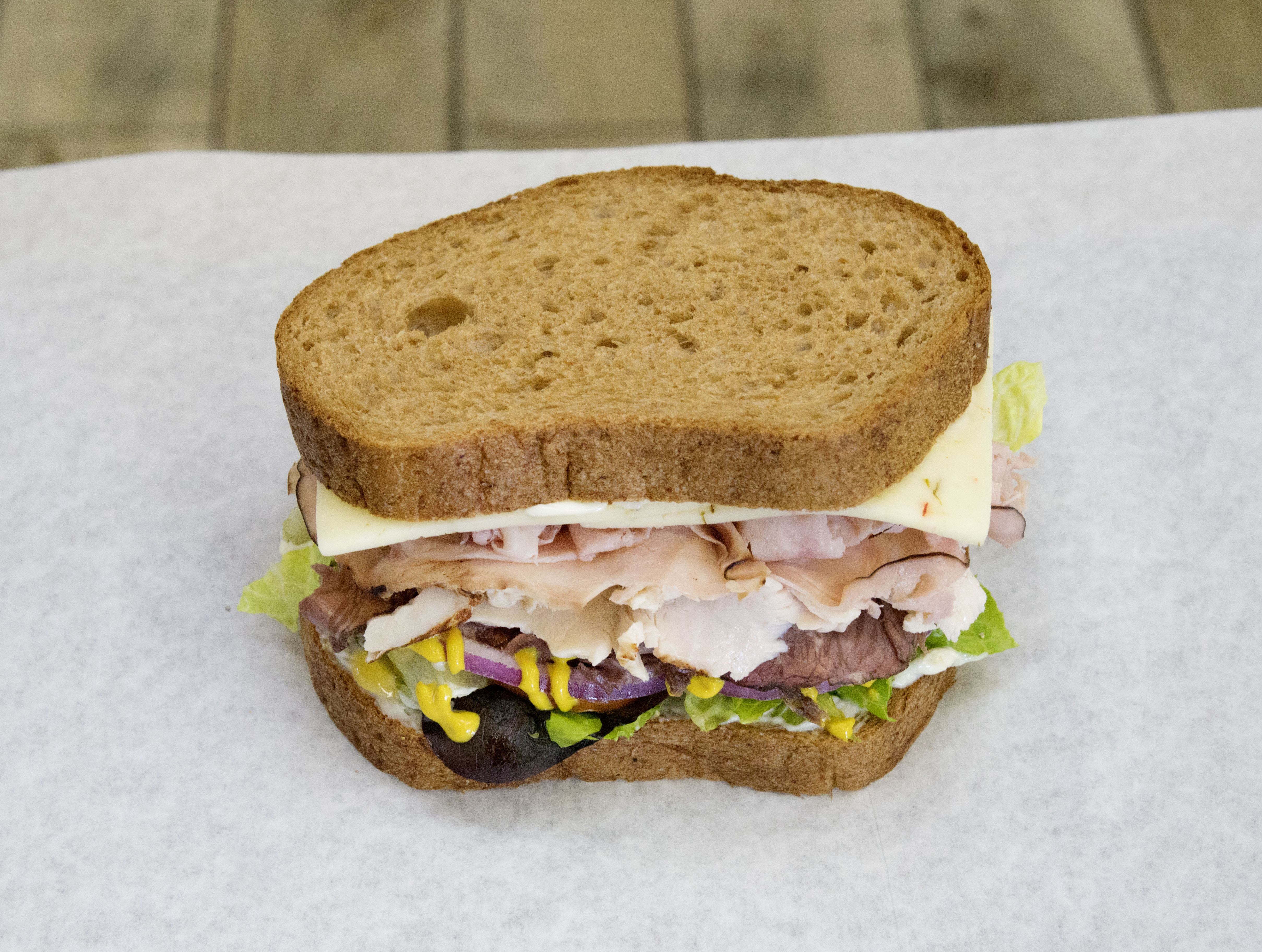 Order 8" Charger Club Sandwich food online from Knockout Deli store, San Diego on bringmethat.com