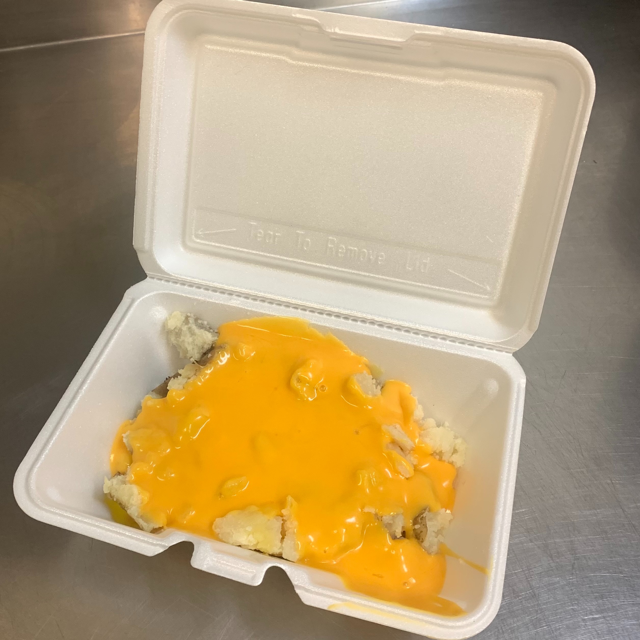 Order 24. Melted Cheddar Cheese Potato food online from Lieber Boxcar Express store, Galesburg on bringmethat.com