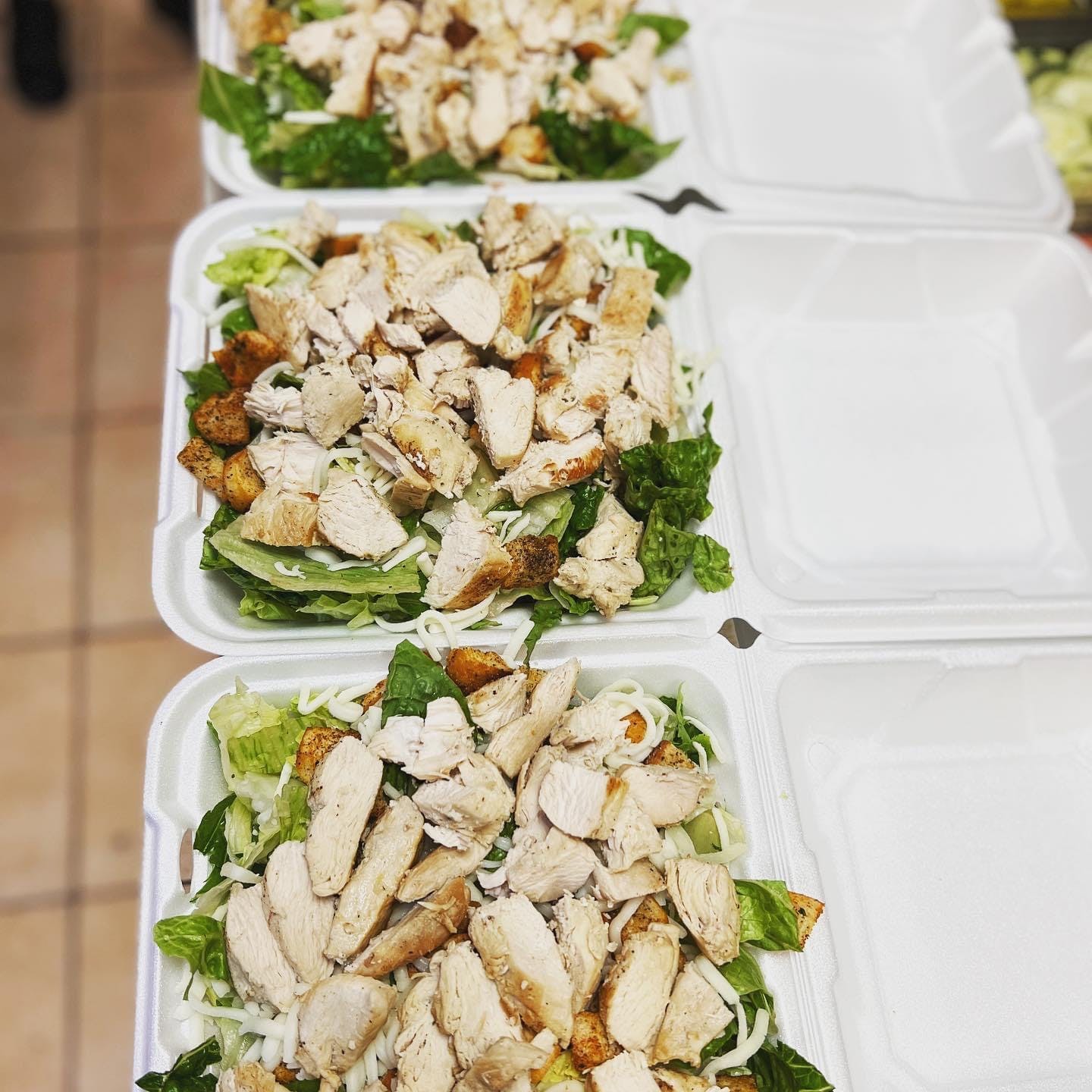 Order Caesar Salad with Chicken - Medium food online from Affamato Pizza & Italian Restaurant store, Norristown on bringmethat.com
