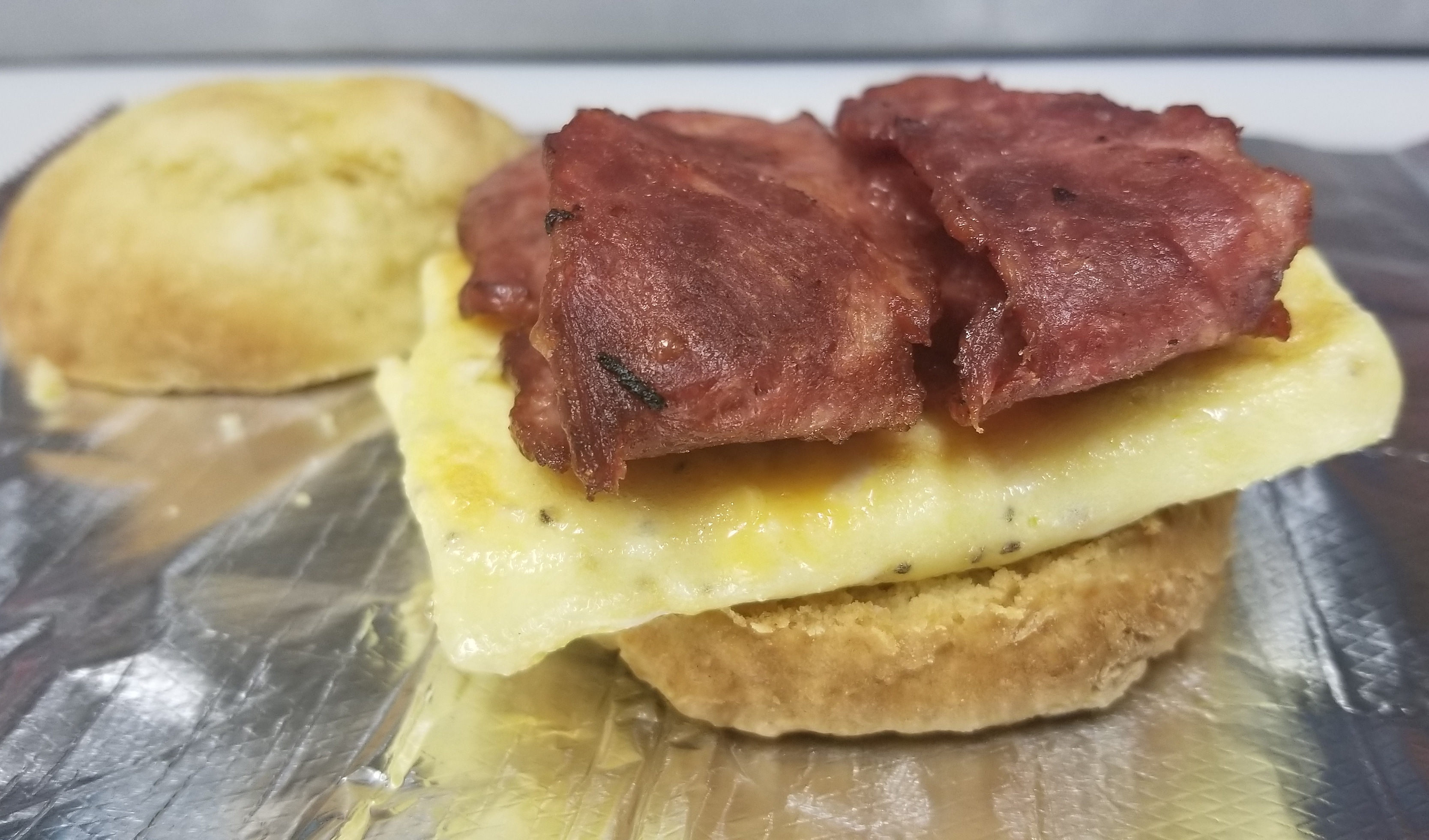 Order Turkey Bacon and Egg Biscuit with Cheese Sandwich food online from 1-11 Coffee Bar store, Chicago on bringmethat.com