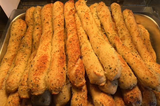 Order Garlic and Cheese Breadstick (ea) food online from Giannis Pizza store, Monterey on bringmethat.com