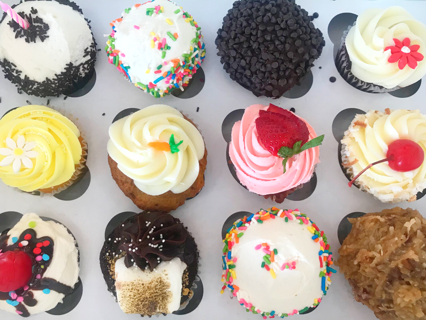 Order Cupcake Drop! (aka one dozen assorted cupcakes) food online from Sugar Blossom Bake Shop store, San Clemente on bringmethat.com