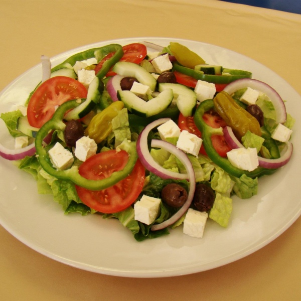 Order Greek Salad food online from La Val's Pizza store, Albany on bringmethat.com