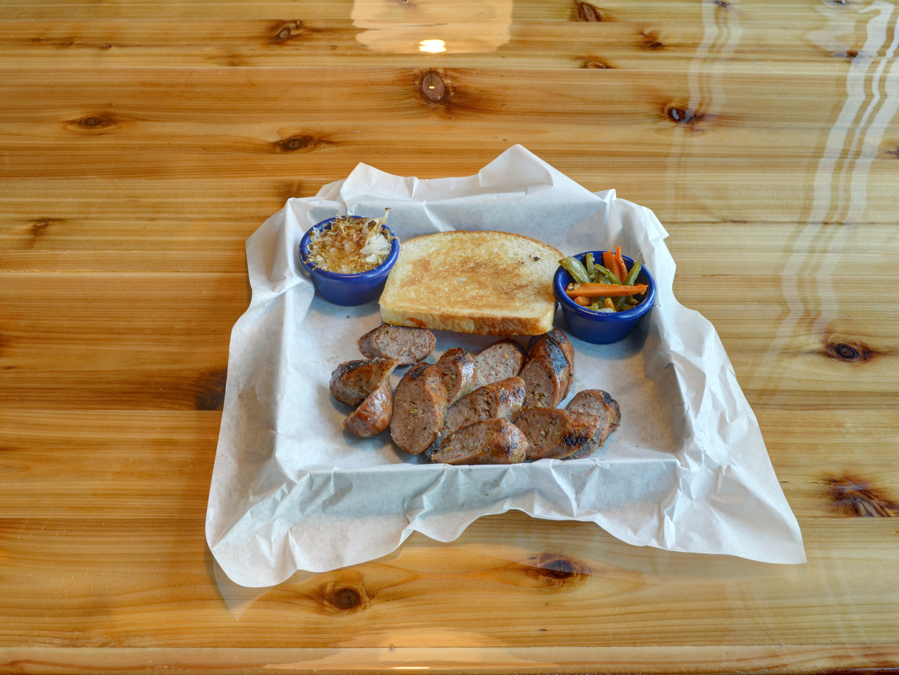 Order Sausage Sampler food online from Cue Barbecue store, Lawrenceville on bringmethat.com