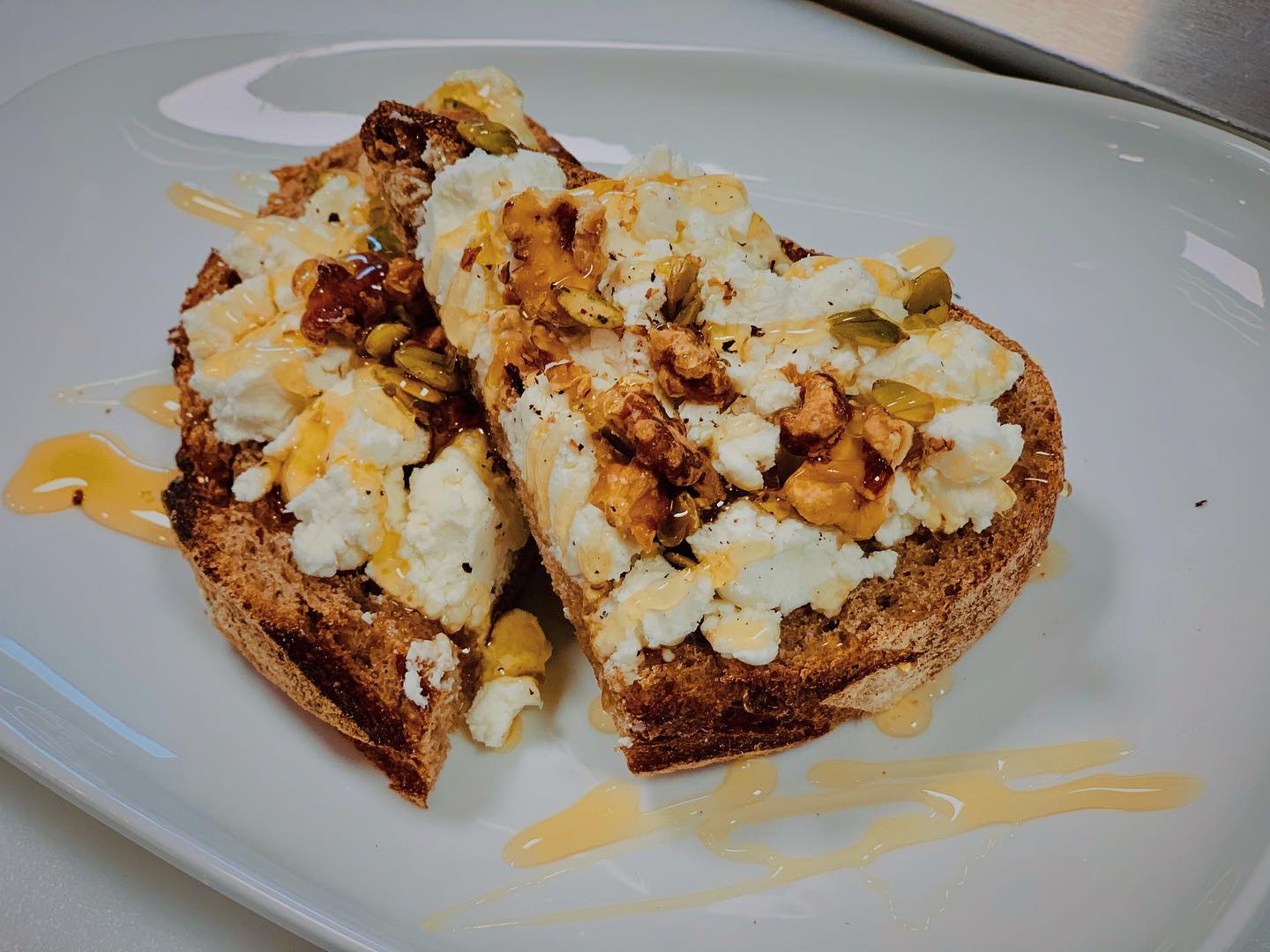 Order Goat Cheese Toast food online from Kaffeine store, Grand Rapids on bringmethat.com
