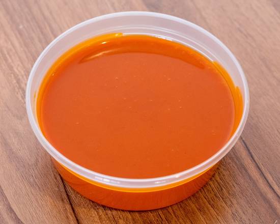 Order Side of Buffalo Sauce - 2 oz food online from Captain Jay Fish & Chicken store, Eastpointe on bringmethat.com