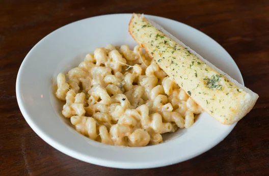 Order Kids Mac N' Cheese food online from Oregano's Pizza Bistro store, Tempe on bringmethat.com