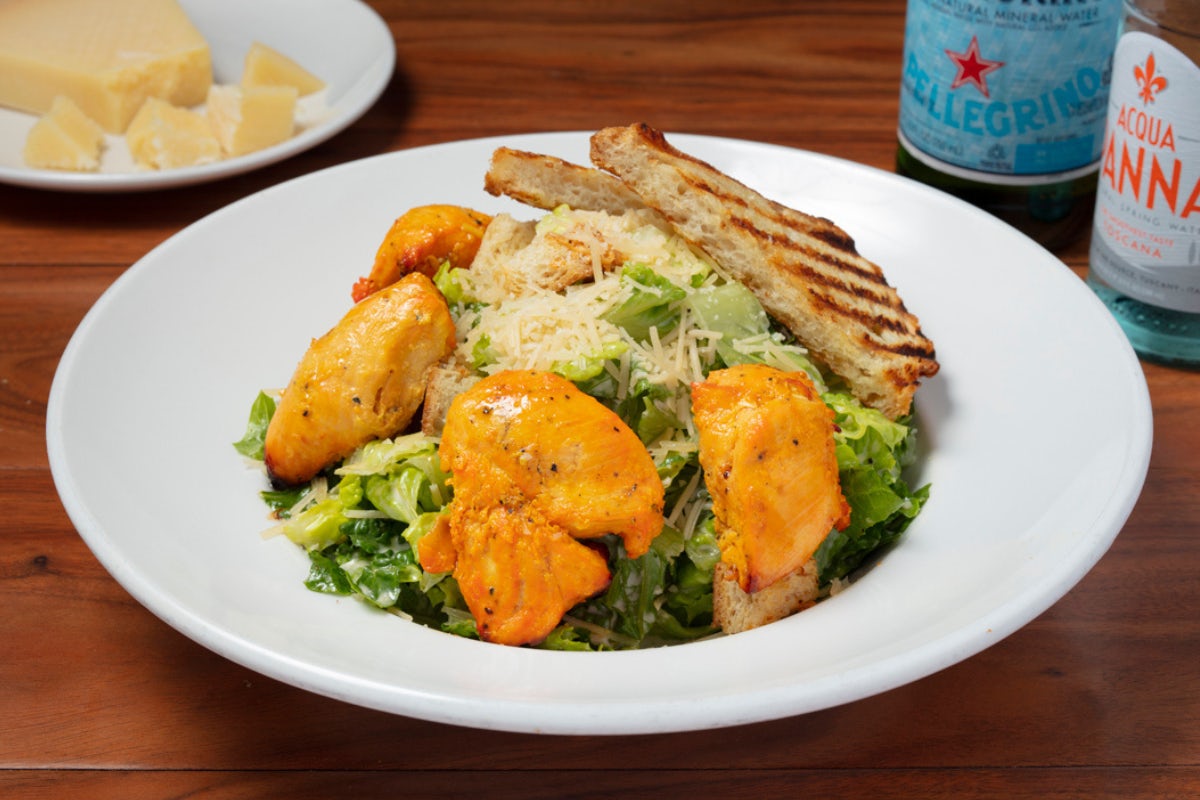 Order Caesar Salad* food online from Panini Kabob Grill store, Woodland Hills on bringmethat.com