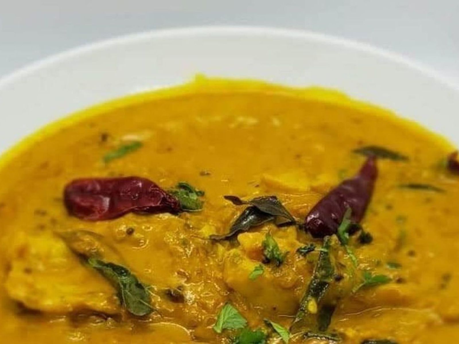 Order Malabar Fish Curry food online from Indian Cuisine store, Philadelphia on bringmethat.com