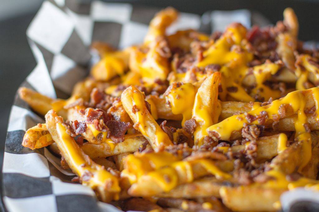 Order Cheddar and Bacon Fries food online from Sneaker's Sports Bar and Grill store, Franklin Park on bringmethat.com