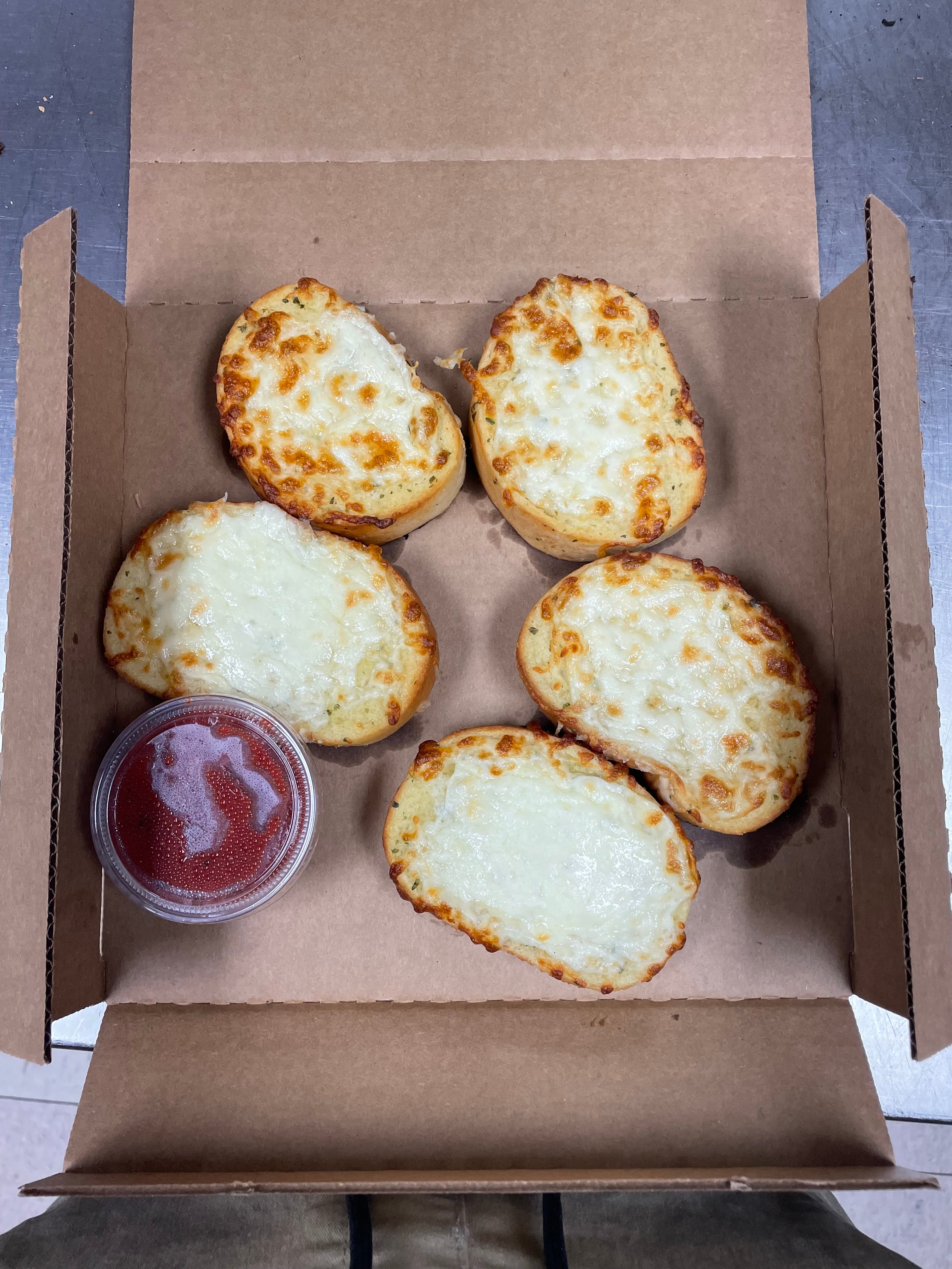 Order Garlic Texas Toast with Cheese - 5 Pieces food online from Pizza Man store, Ellsworth on bringmethat.com
