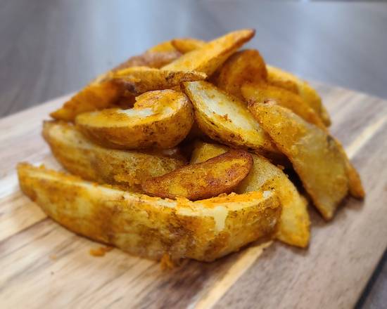 Order Potato Wedges (1 lb) food online from Jalapenos Pizza & Wings store, Laredo on bringmethat.com