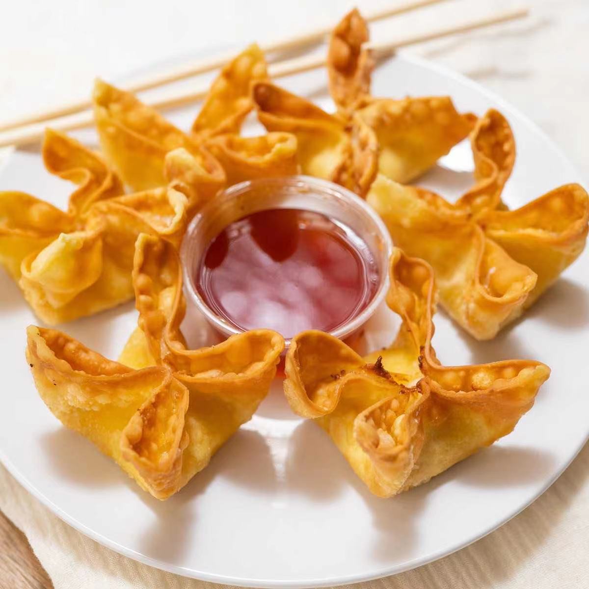 Order 7. Crab Rangoon food online from The Kung Fu store, Lansing on bringmethat.com