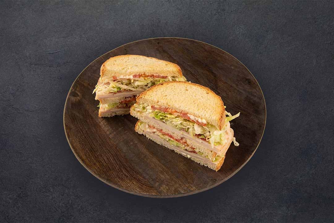 Order Turkey & Cheese Club Sandwich - Full food online from Westshore Pizza store, Tampa on bringmethat.com
