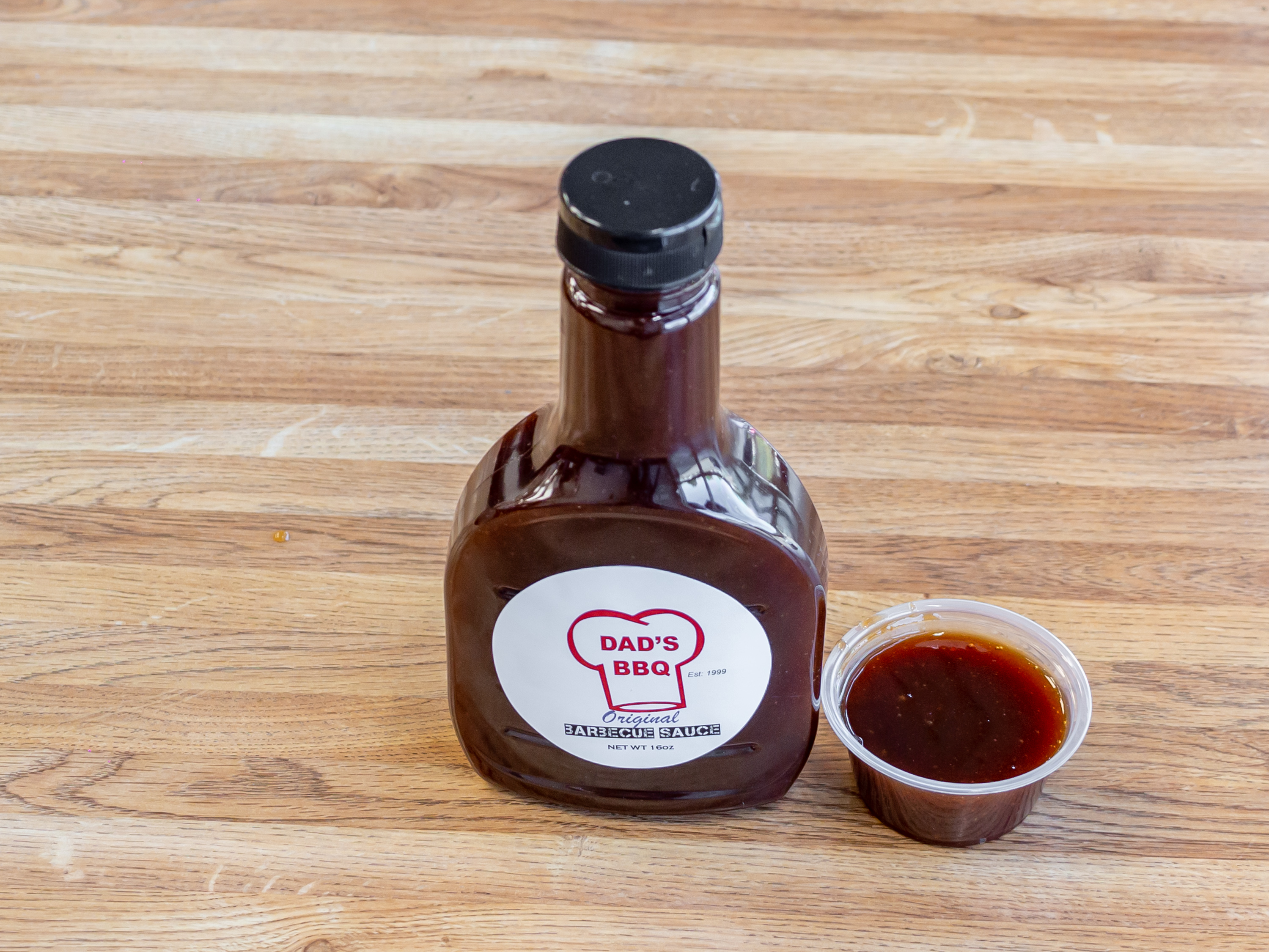 Order 16 oz. Bottle of Sauce food online from Dad Bbq store, Antioch on bringmethat.com