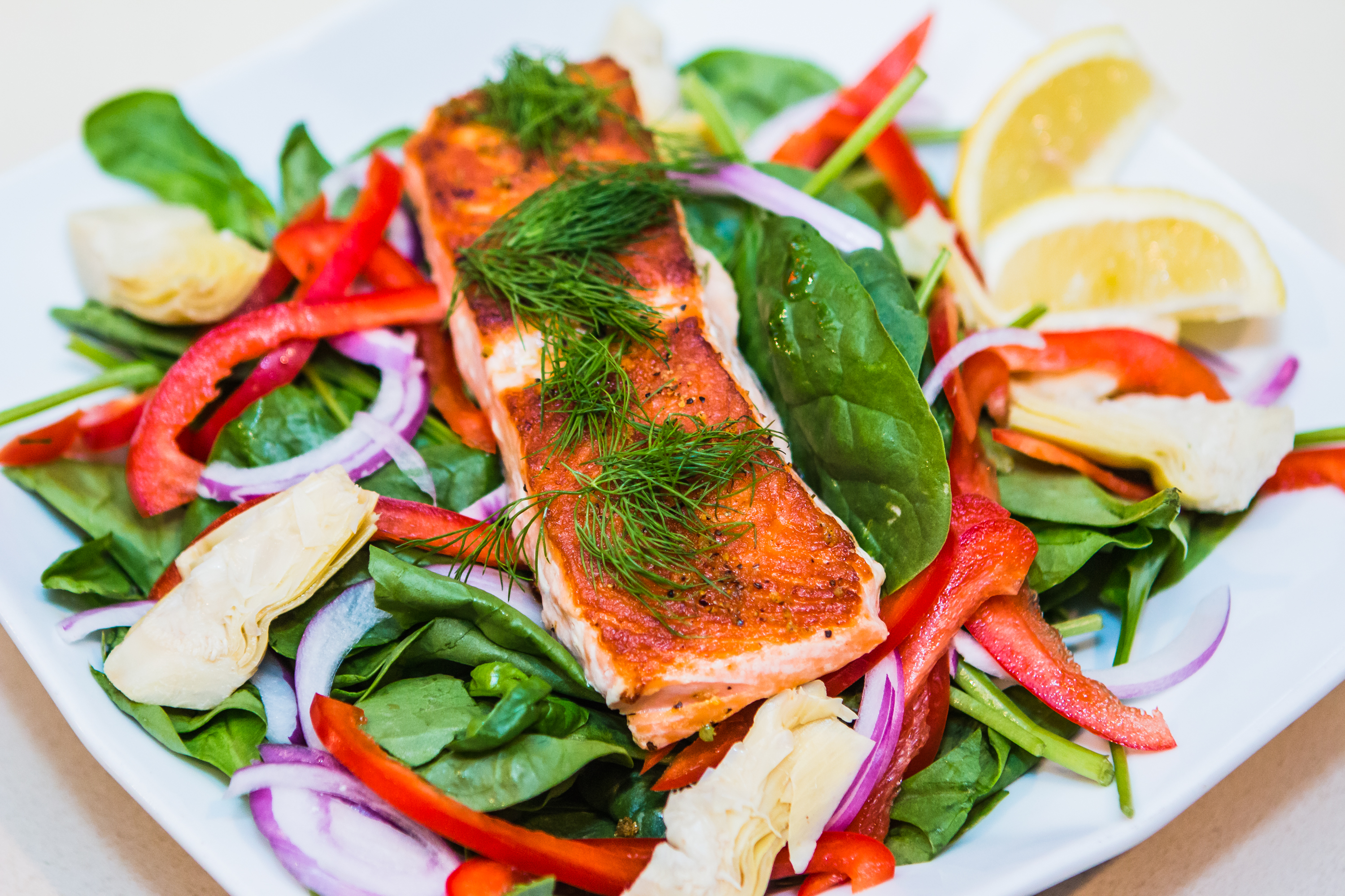 Order Grilled Salmon Salad food online from Panini Pizza & Italian Kitchen store, West Hollywood on bringmethat.com