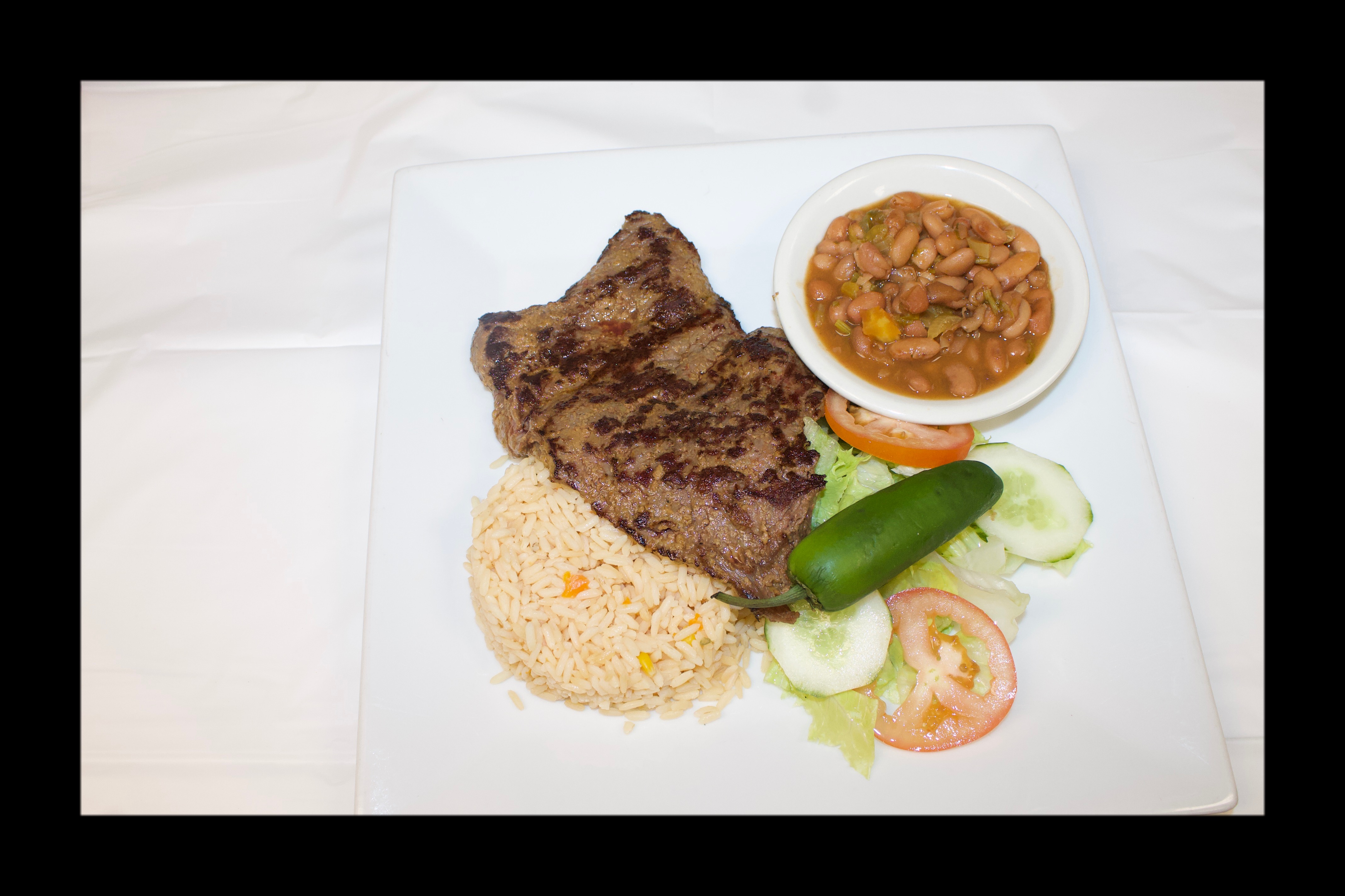 Order Carne Asada food online from Los Paisanos Catering store, Somerville on bringmethat.com
