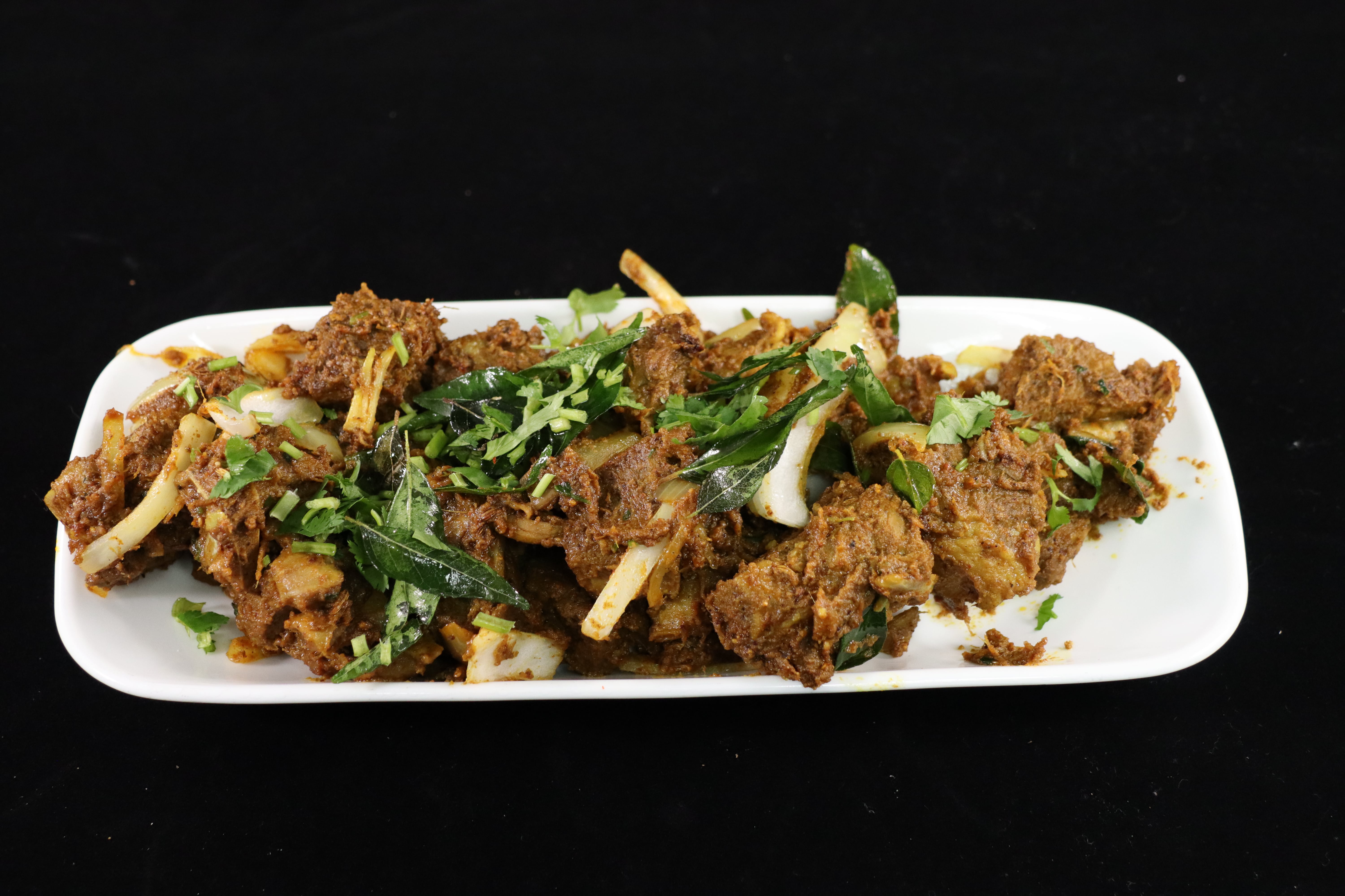 Order Goat Sukka food online from Biryani Hub store, Norfolk on bringmethat.com