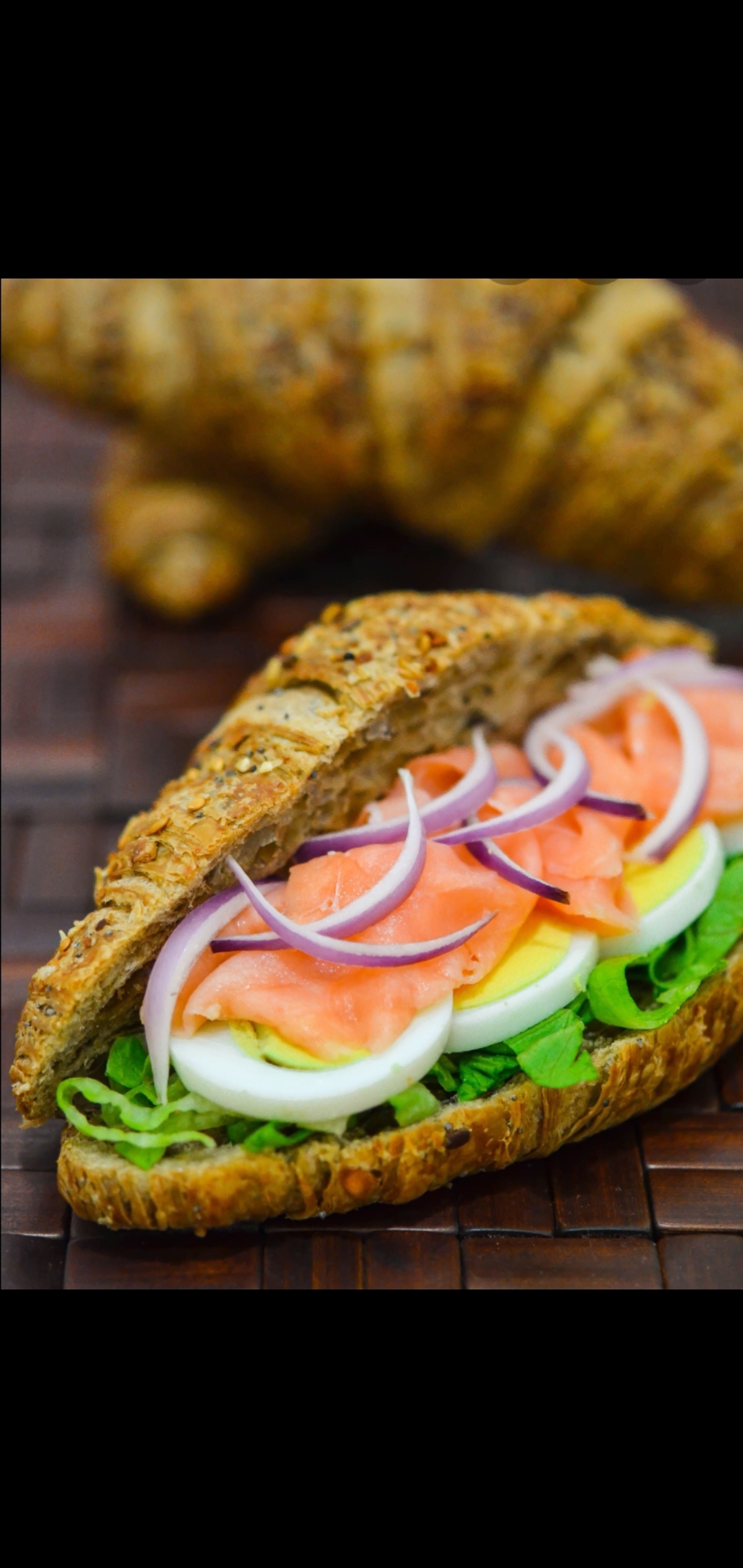 Order Nova Smoked Salmon Boiled Egg Red Onions & Romaine Lettuce Gourmet Croissant Sandwich  food online from American Gourmet Foods Deli store, New York on bringmethat.com