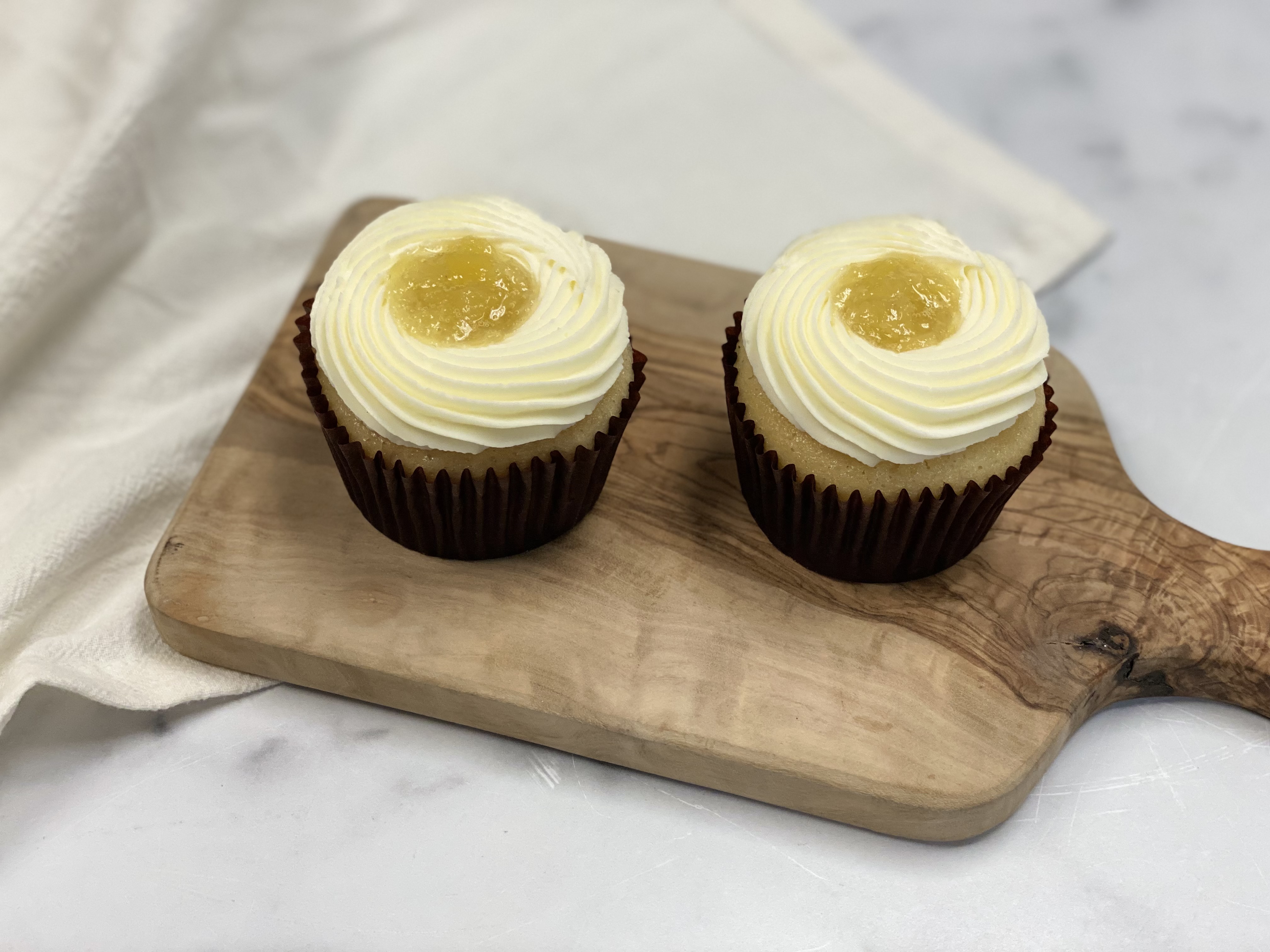 Order Set of 2 Golden Pineapple Cupcake food online from 43 & Company store, Milpitas on bringmethat.com