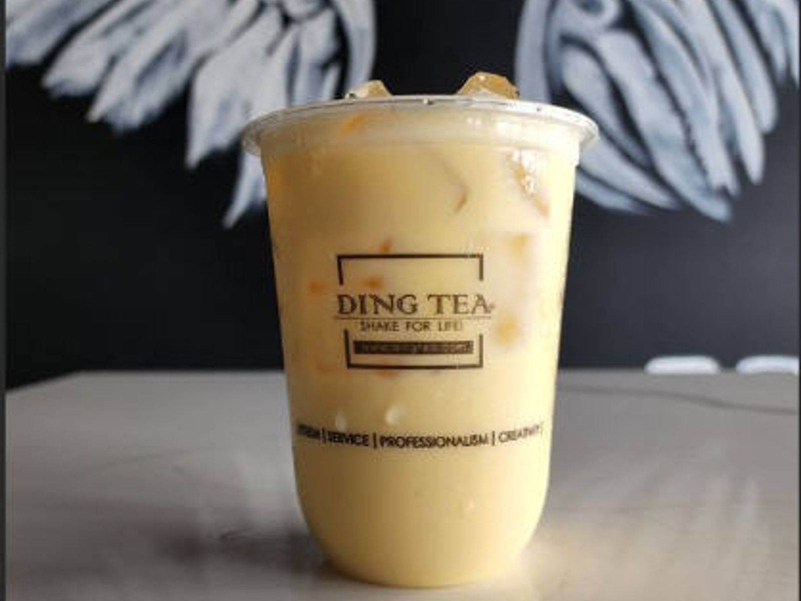 Order Passion Fruit Green Milk Tea food online from Ding Tea Carson store, Carson on bringmethat.com