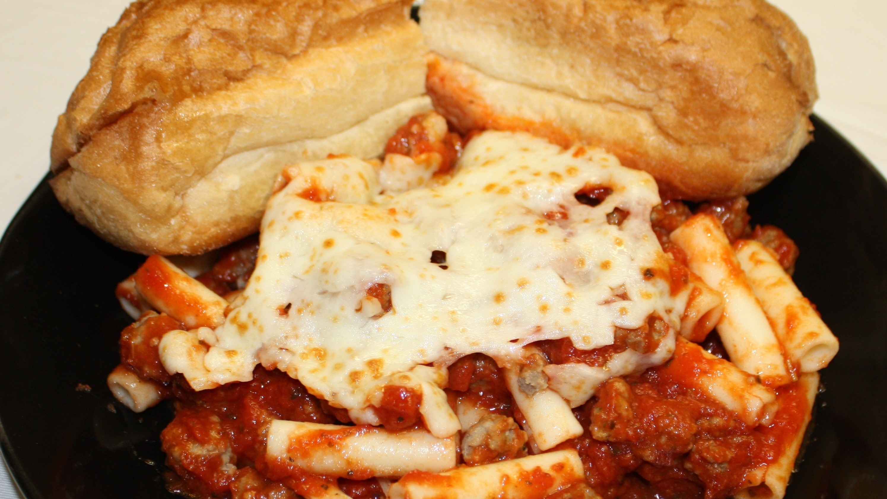Order Baked Ziti with Beef food online from Manny & Olga's Pizza store, Washington on bringmethat.com