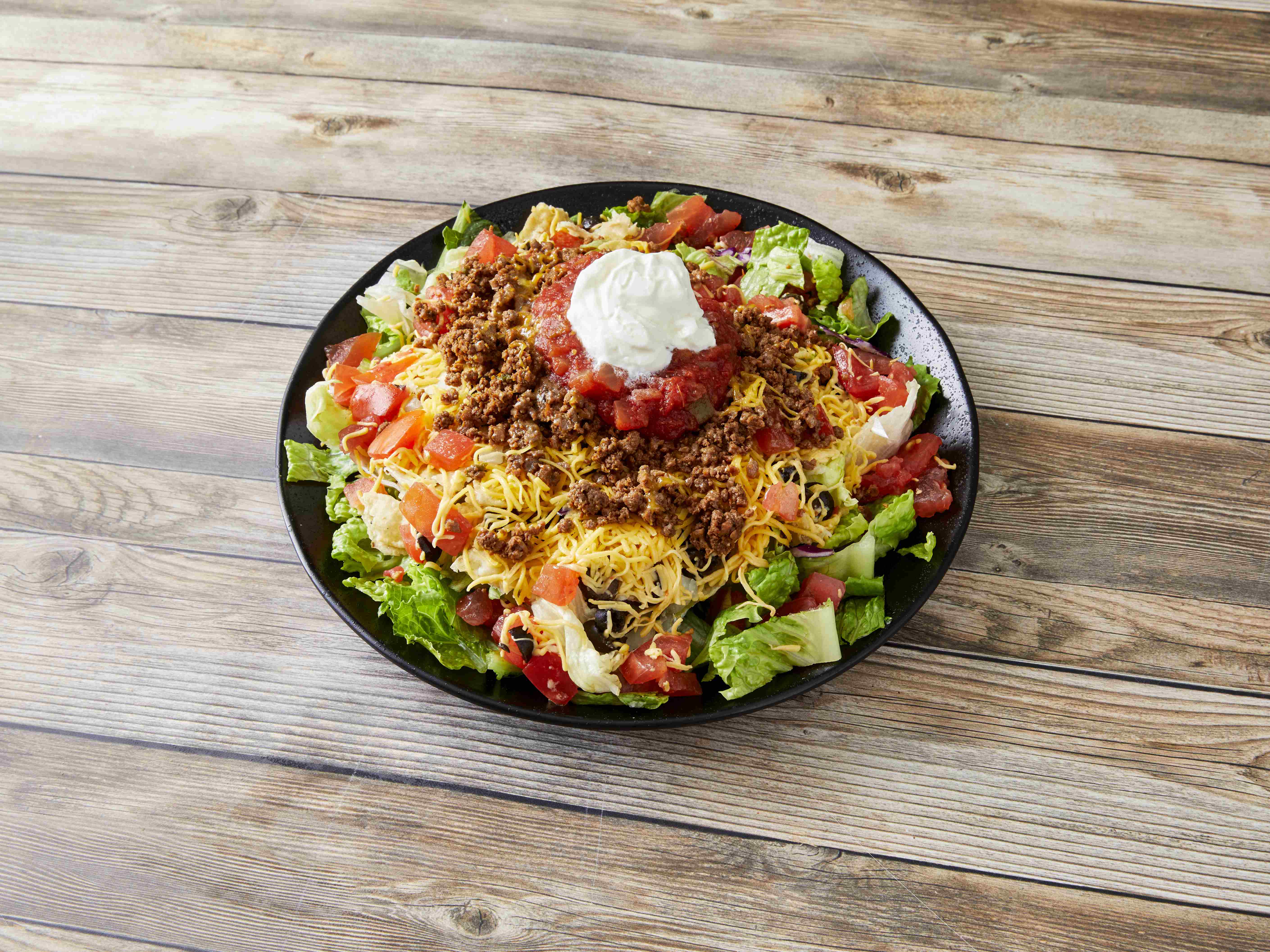 Order Taco Salad food online from Bellacino's Pizza & Grinders store, Muskegon on bringmethat.com