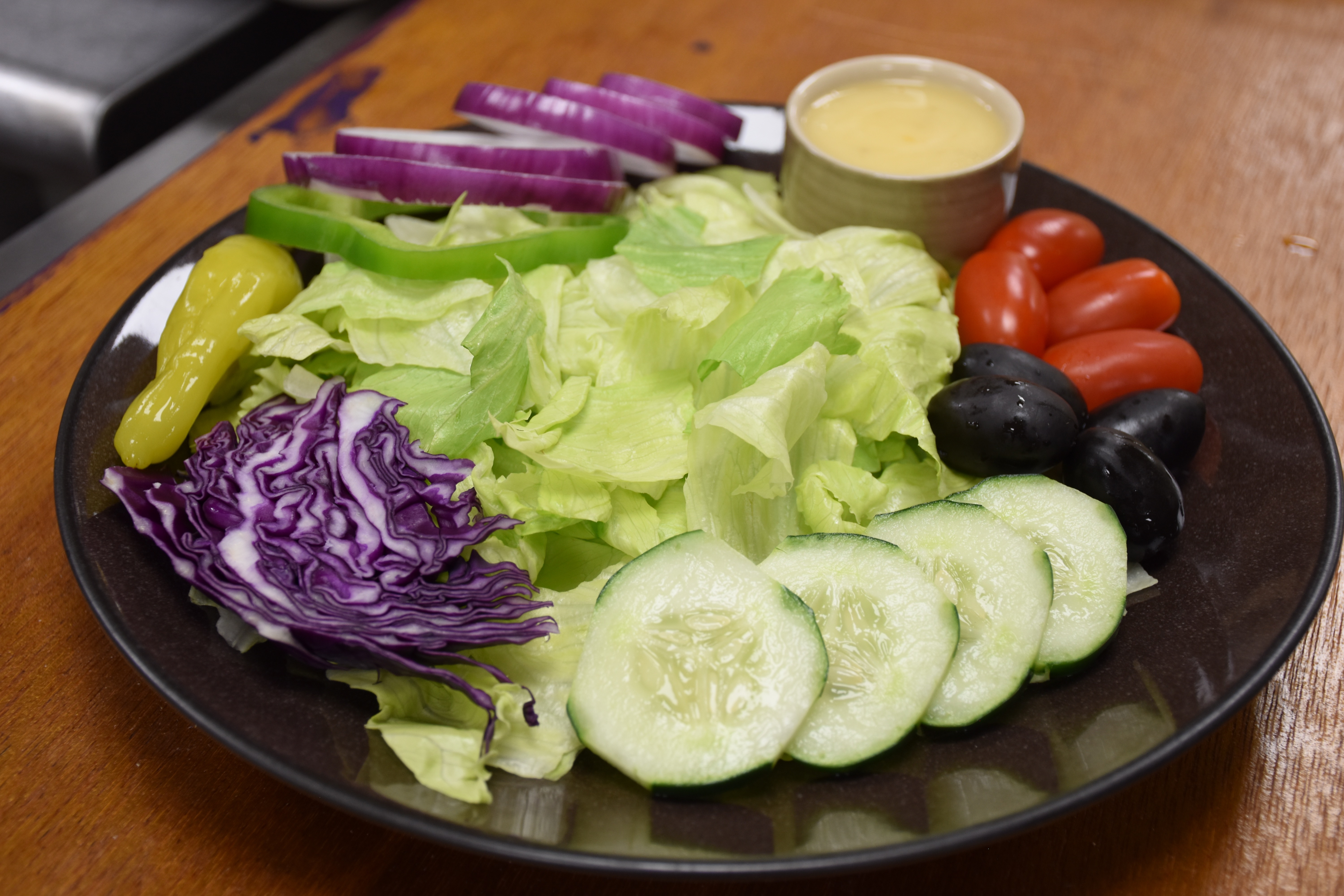 Order Garden Salad food online from Pizzaman Restaurant store, Columbia on bringmethat.com
