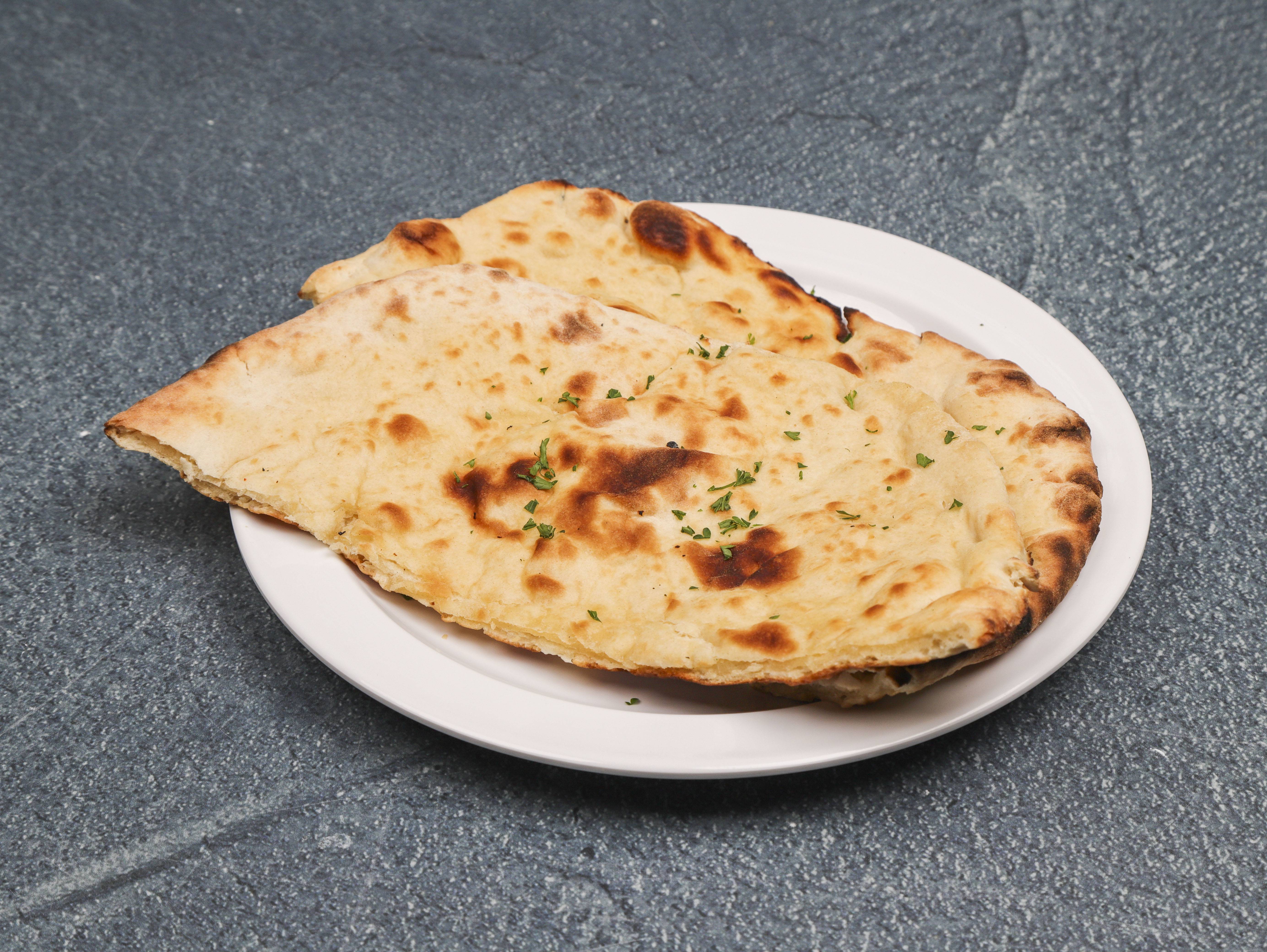 Order Plain Naan food online from The Royal Indian Cuisine store, Philadelphia on bringmethat.com