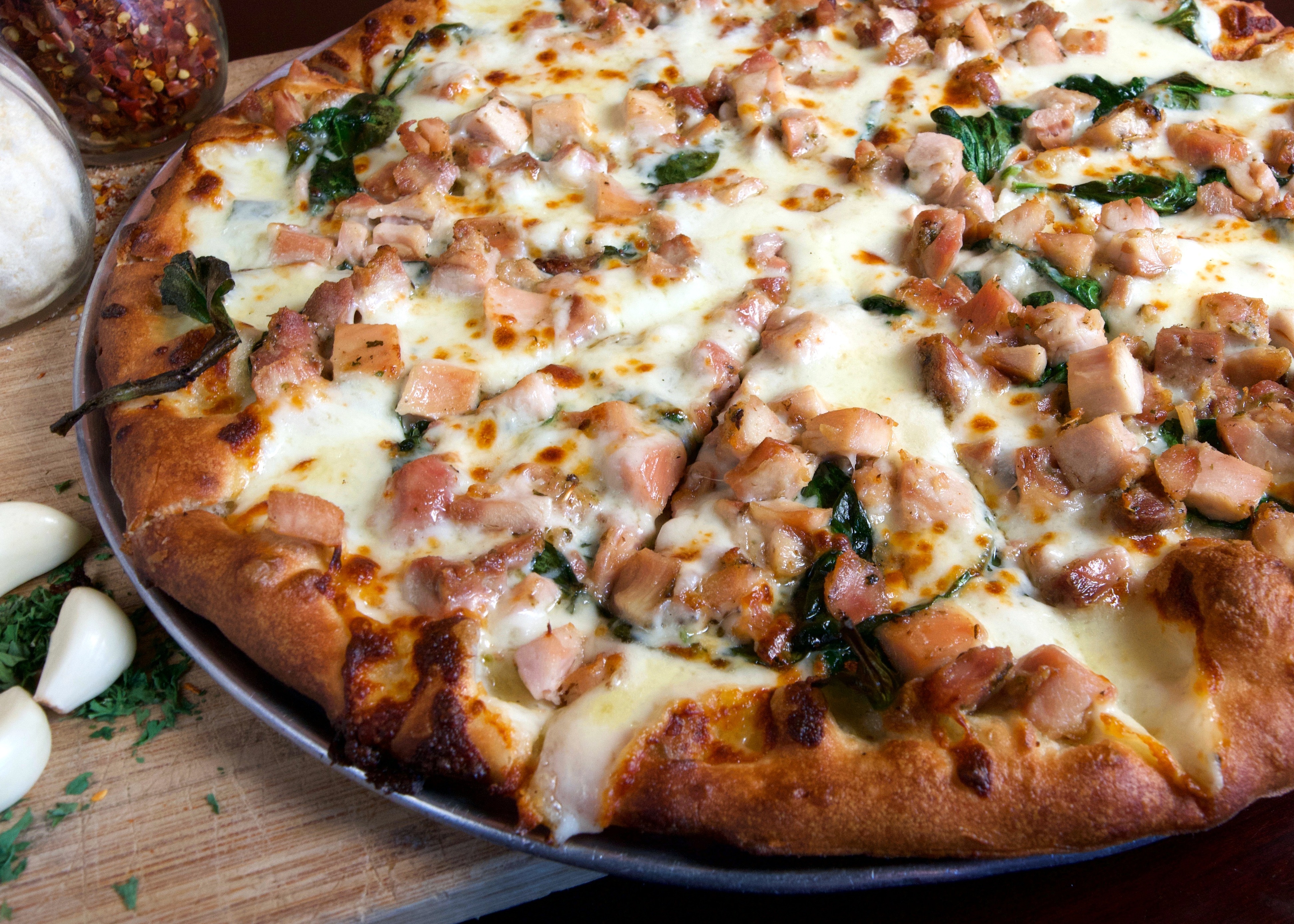 Order Spinach Alfredo Chicken Pizza food online from Leaning Tower Pizza & Pasta store, Sherman Oaks on bringmethat.com