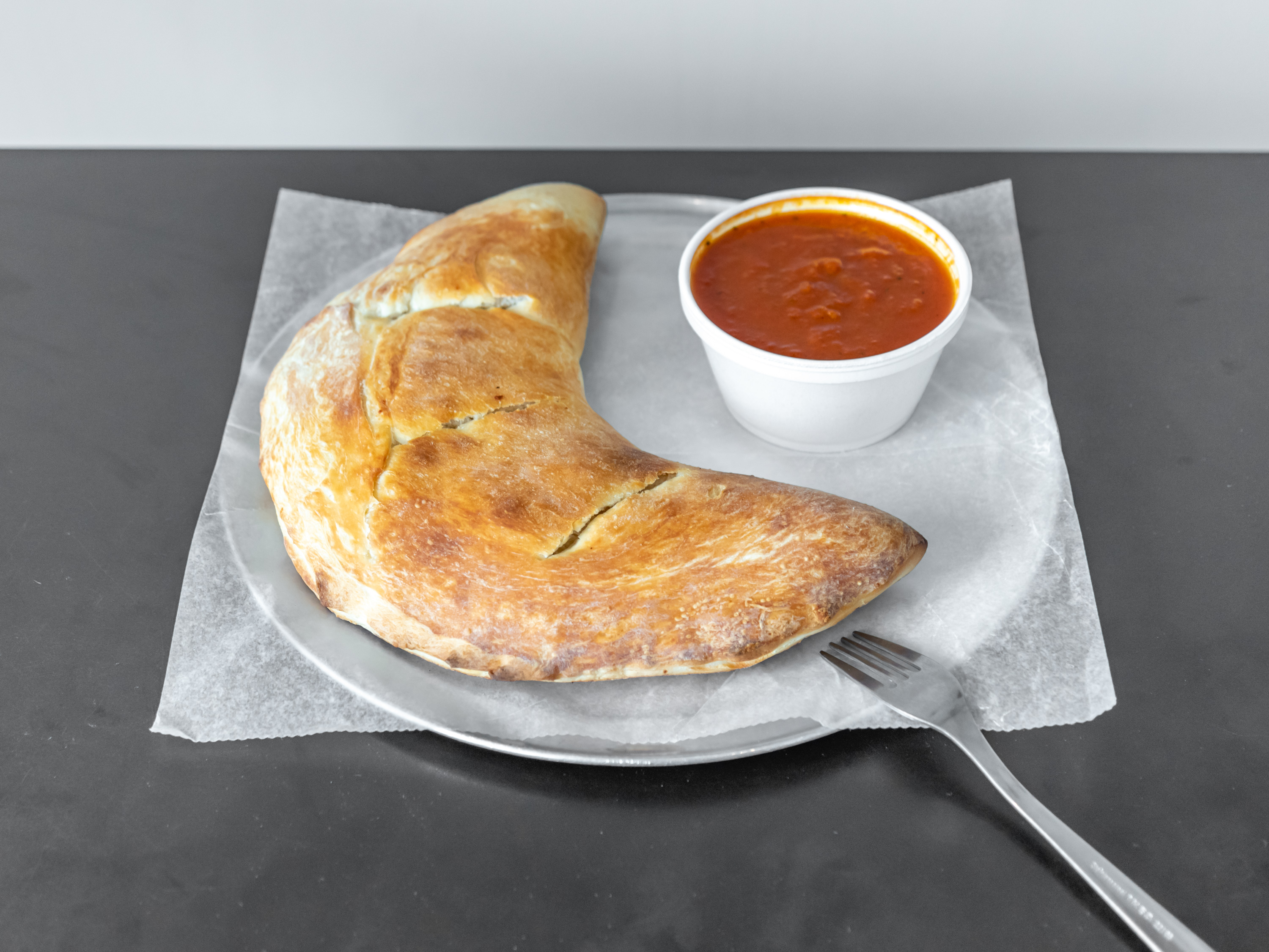 Order Cheese Calzone  food online from Mikes Pizzeria store, Manchester on bringmethat.com