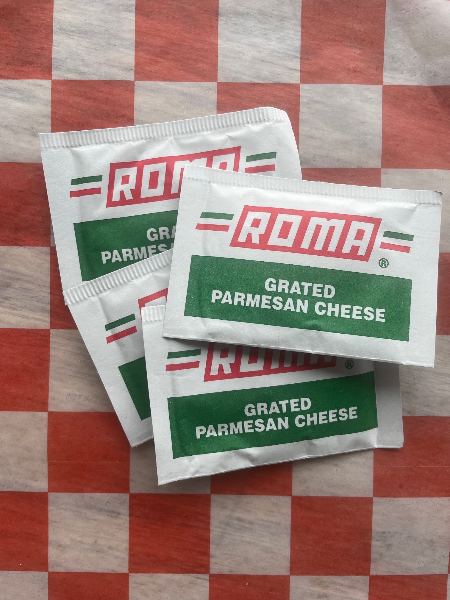 Order Grated Parmesan Cheese - Four Packets food online from Jimmy's Pizza Litchfield store, Litchfield on bringmethat.com