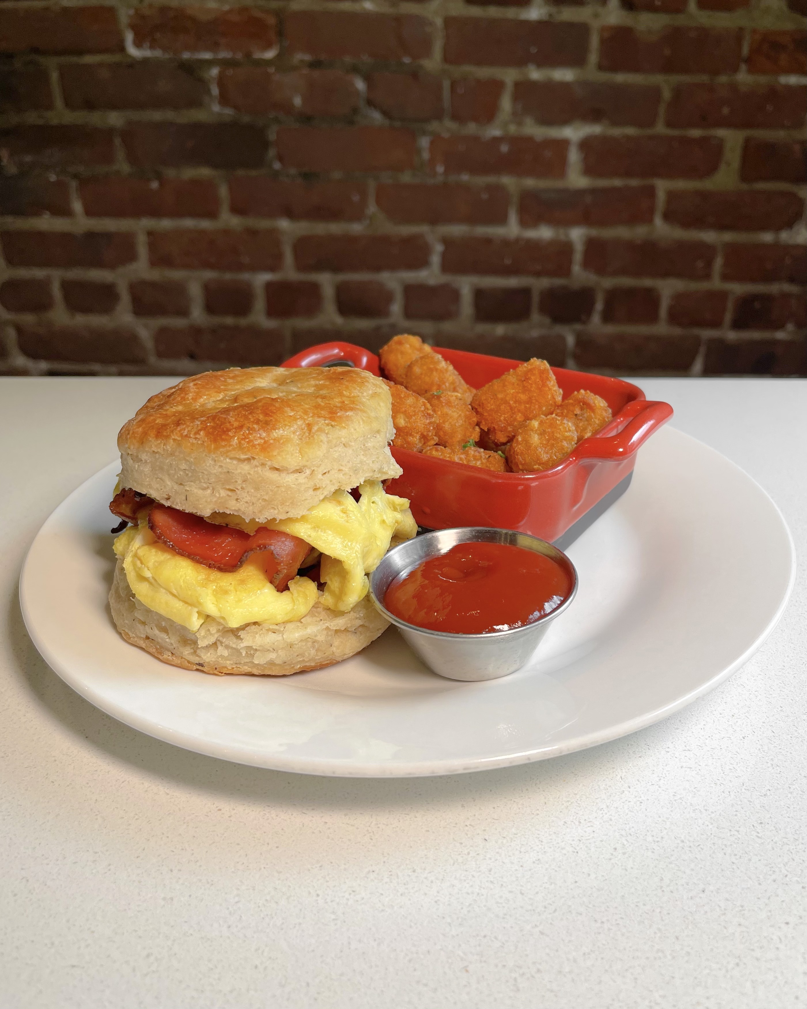 Order Bacon egg and cheese on a homemade biscuit  food online from Parker store, West New York on bringmethat.com