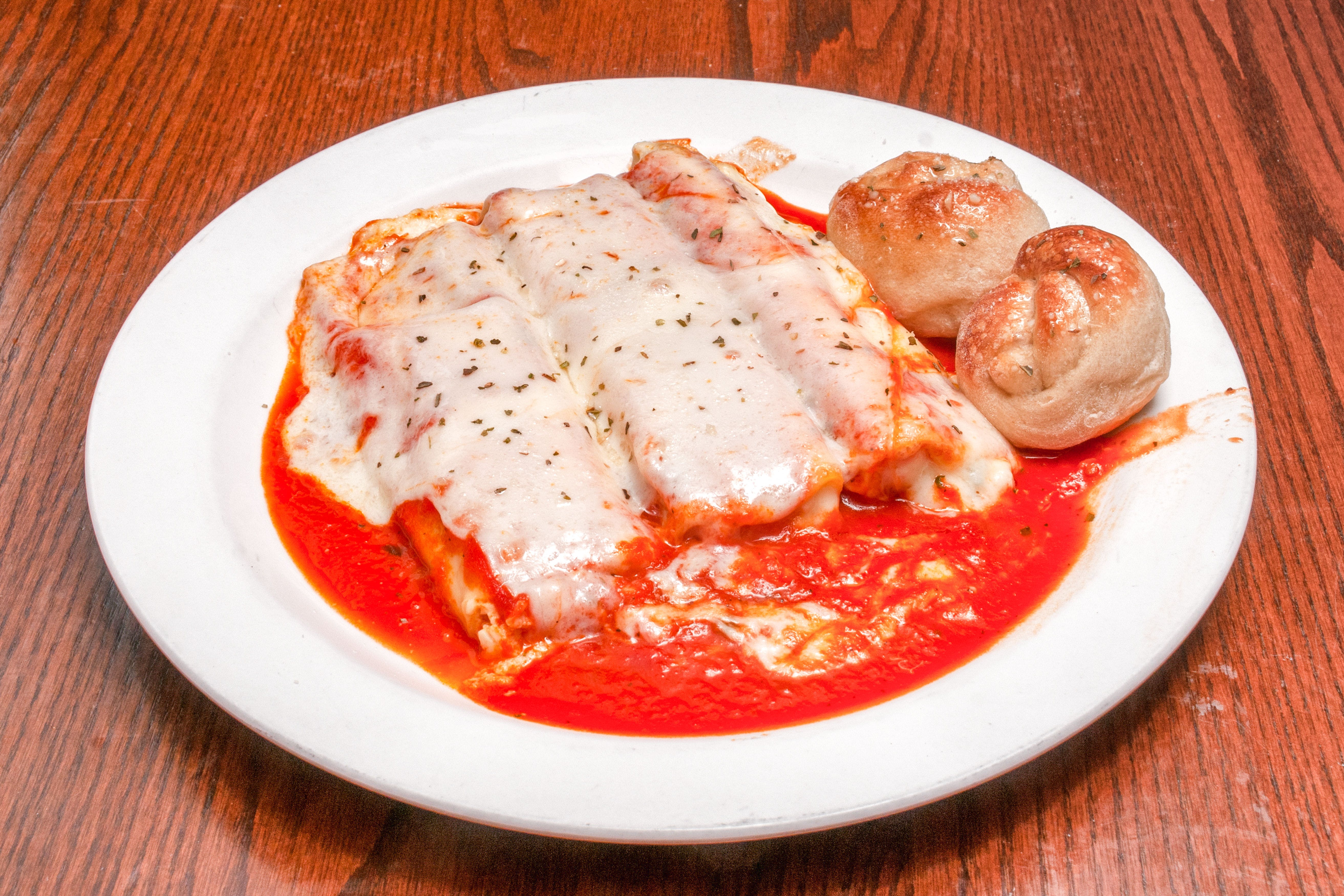 Order Manicotti - Pasta food online from Primo Pizza Ny Style store, Cary on bringmethat.com
