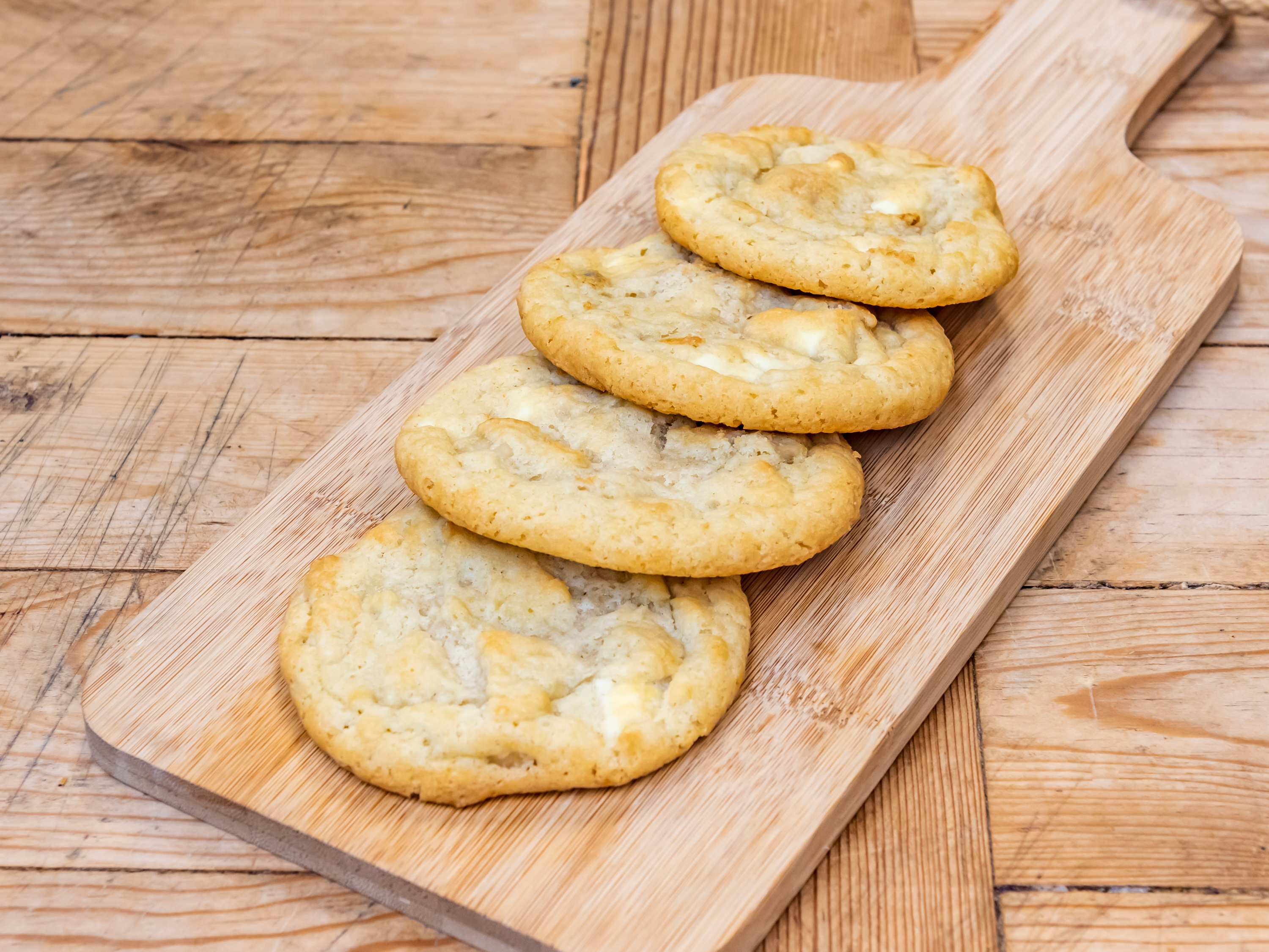 Order White Chocolate Macadamia Nut Cookie EA food online from New World Bakery store, Kyle on bringmethat.com