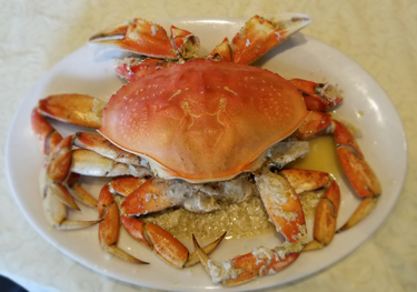Order Steamed Garlic Crab food online from PPQ Dungeness Island store, San Francisco on bringmethat.com