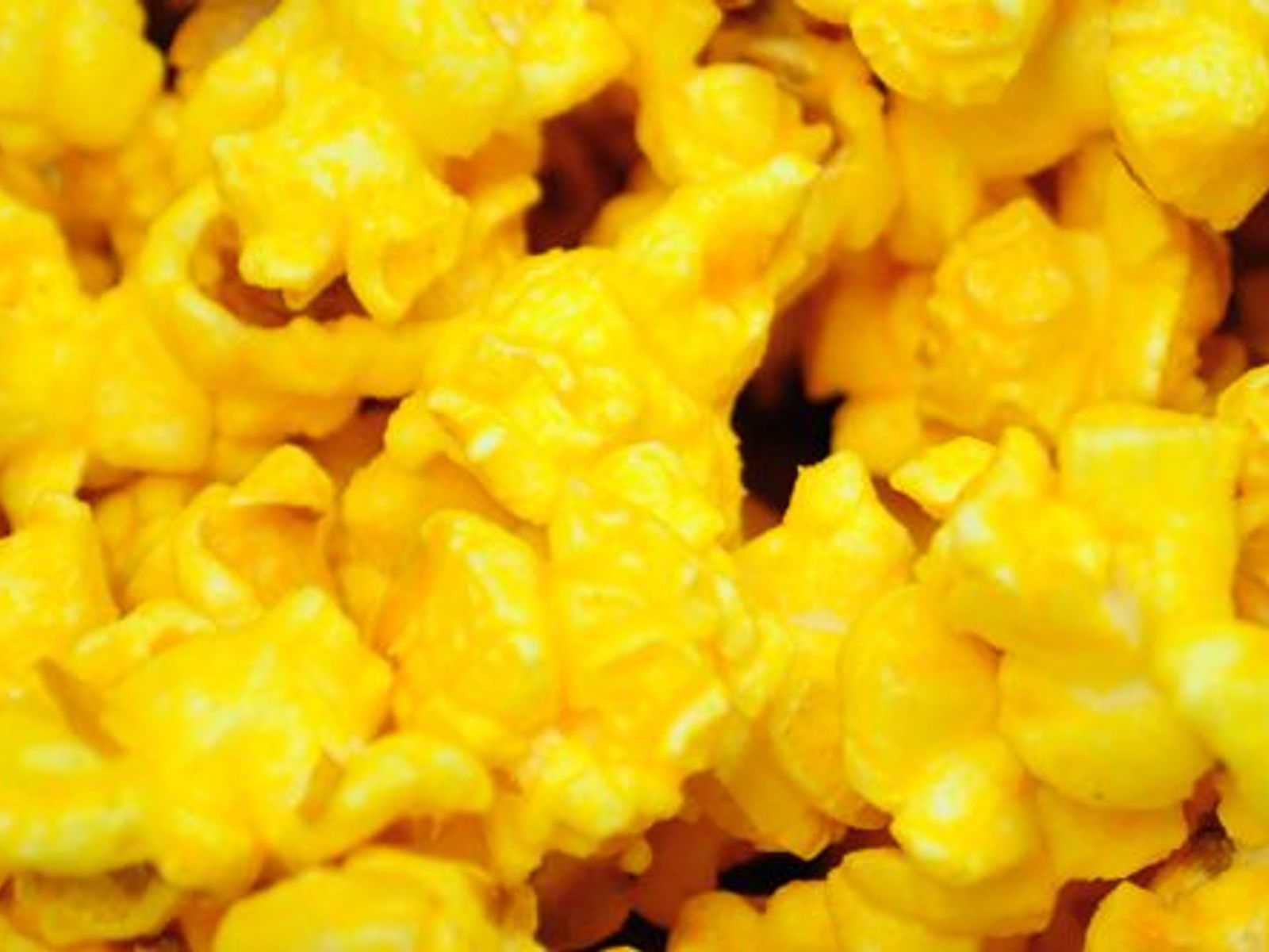 Order MOVIE BUTTER food online from Poparazzis Popcorn store, Houston on bringmethat.com