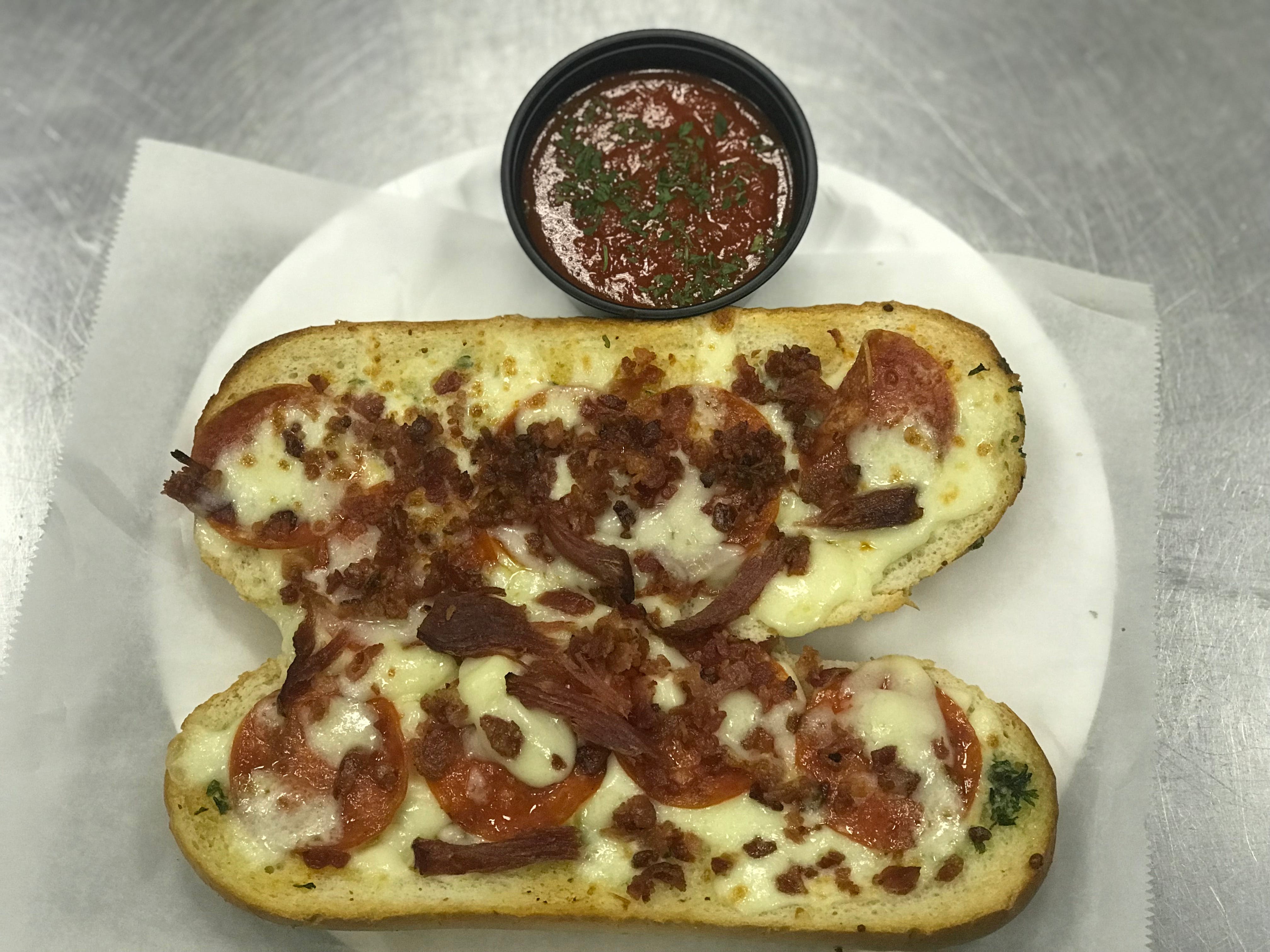 Order Loaded Garlic Bread - Appetizer food online from Brick 3 Pizza store, Milwaukee on bringmethat.com