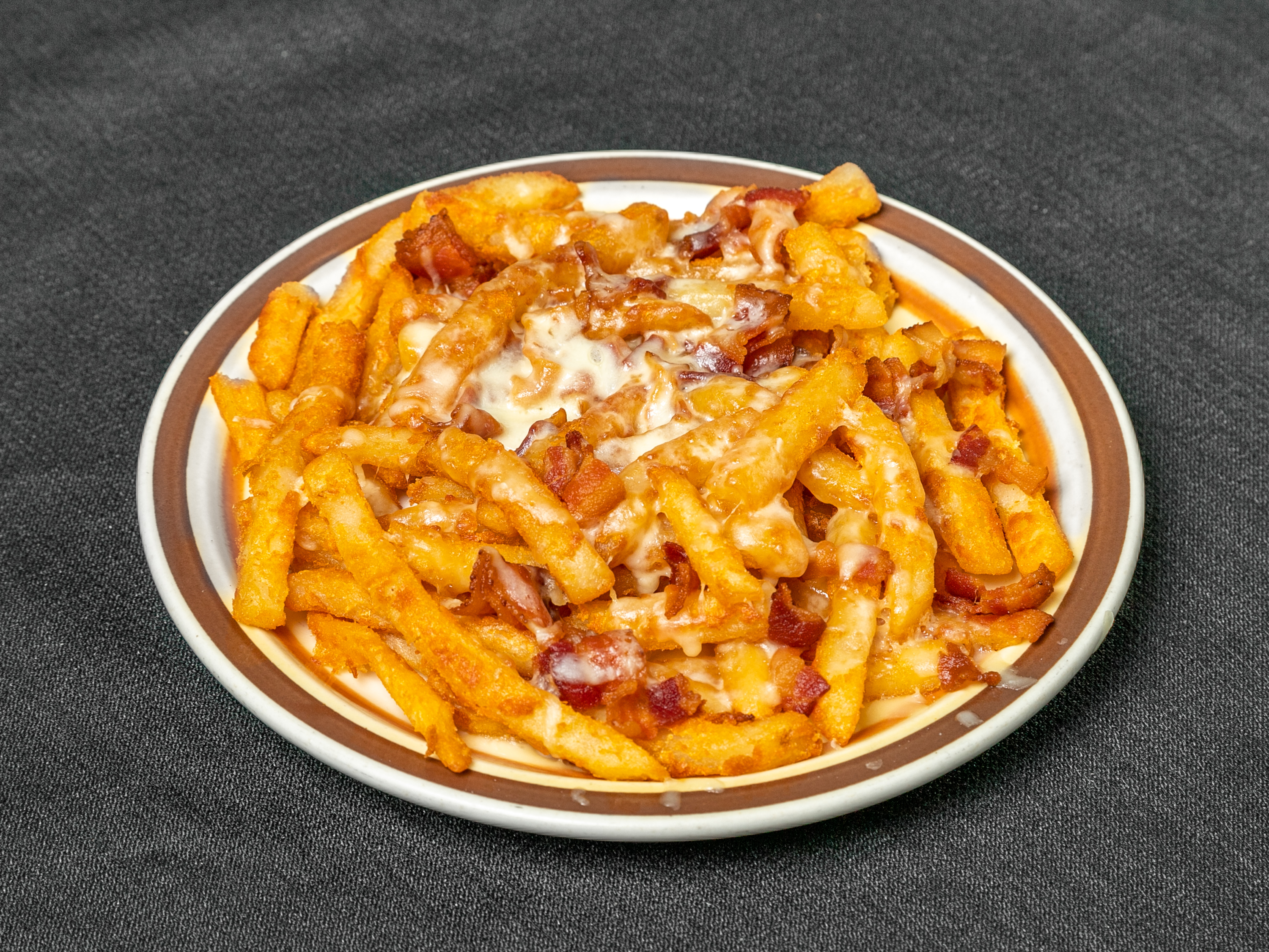 Order French Fries with Cheese and Bacon food online from Oliveiras Peabody store, Peabody on bringmethat.com