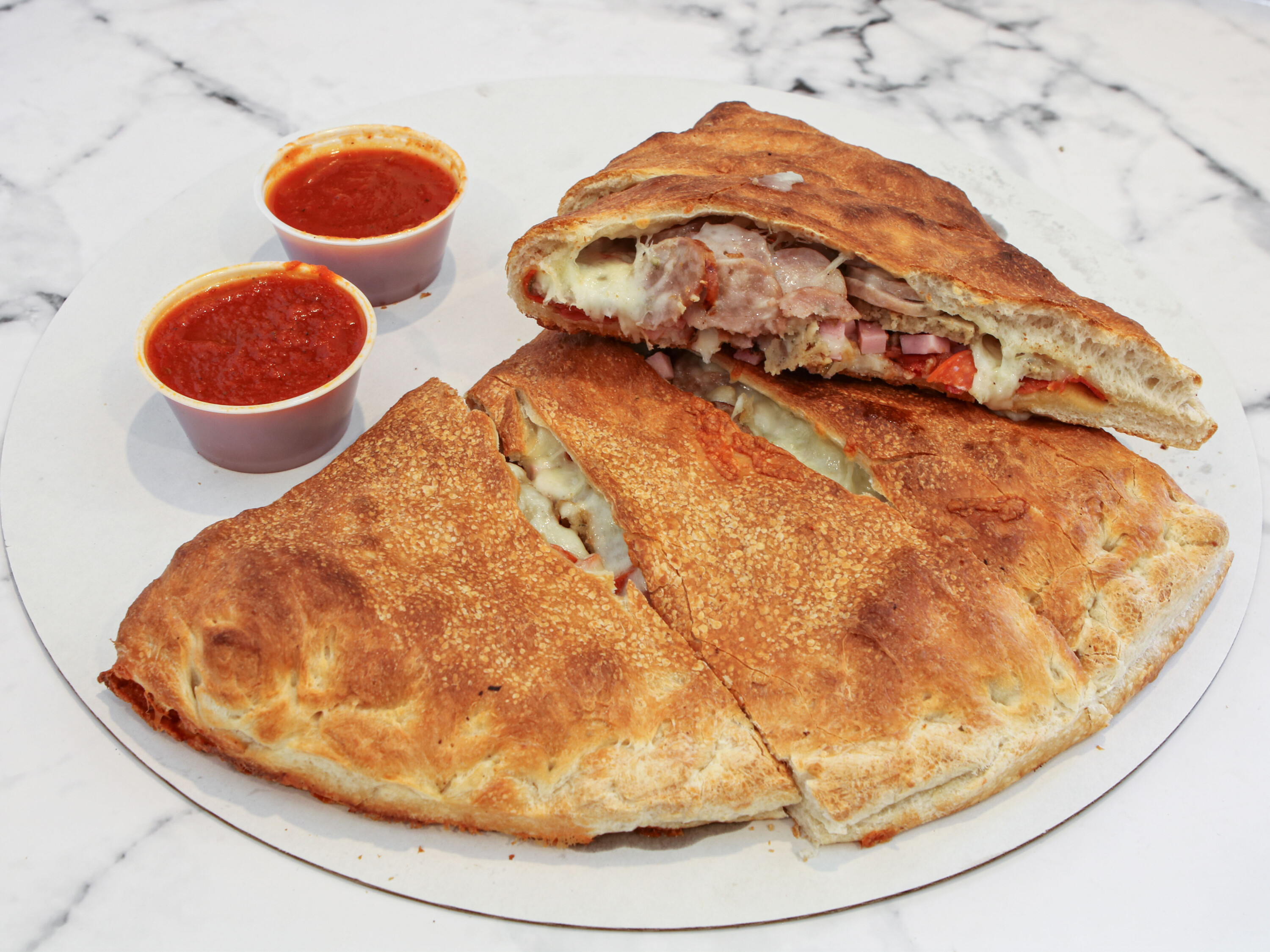 Order Meatball Calzone food online from Yovanis Pizzeria store, Cumberland on bringmethat.com